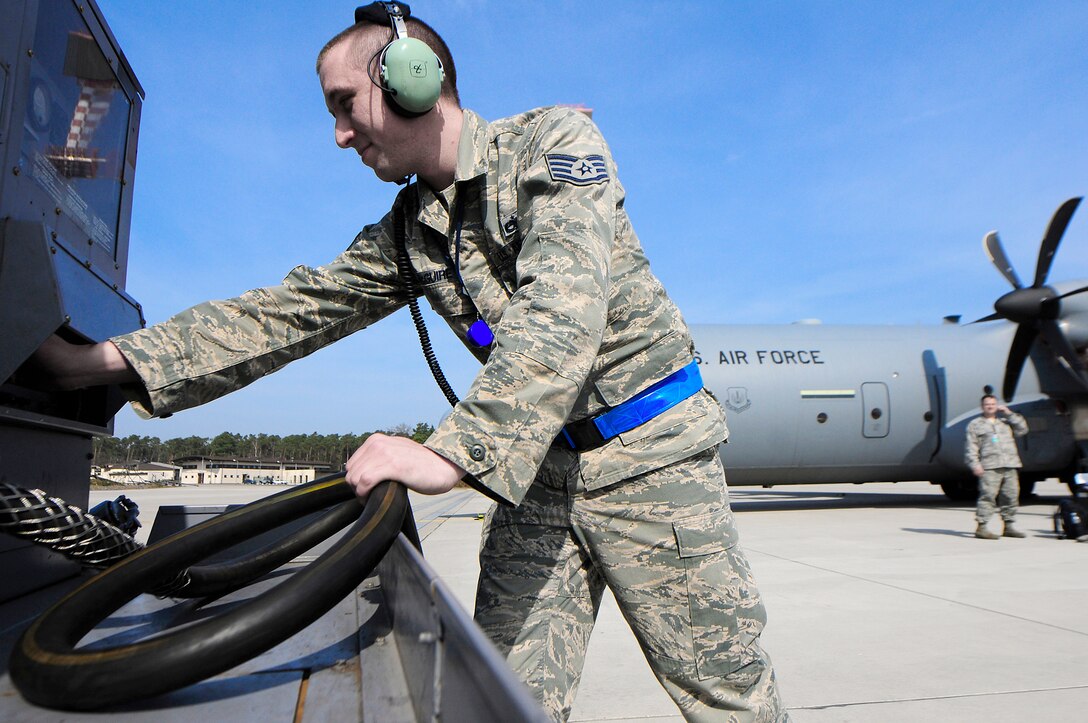 Staff Sgt. Shawn McGuire applies external power to a C-130J Super Hercules March 25, 2011, at Ramstein Air Base, Germany, after its return from a mission in support of Operation Odyssey Dawn. McGuire is assigned to the 86th Aircraft Maintenance Squadron. (U.S. Air Force photo/Airman 1st Class Brea Miller)