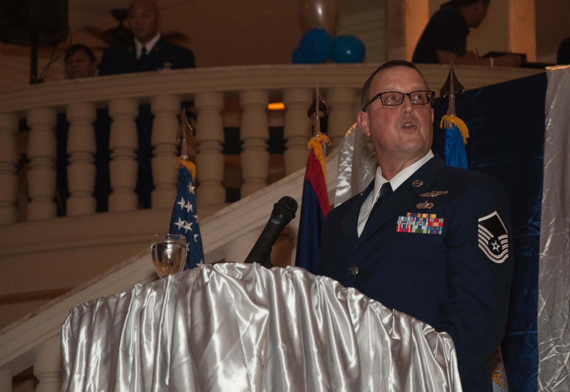 Master Sgt. Kelly Fitzpatrick, 44th Aerial Port Squadron Commander's Support Staff and keynote speaker at the 30th Anniversary Banquet, talks to the audience about the history and pride of the 44th APS, March 26. (U.S. Air Force Photo/Staff Sgt. Erin Smith)