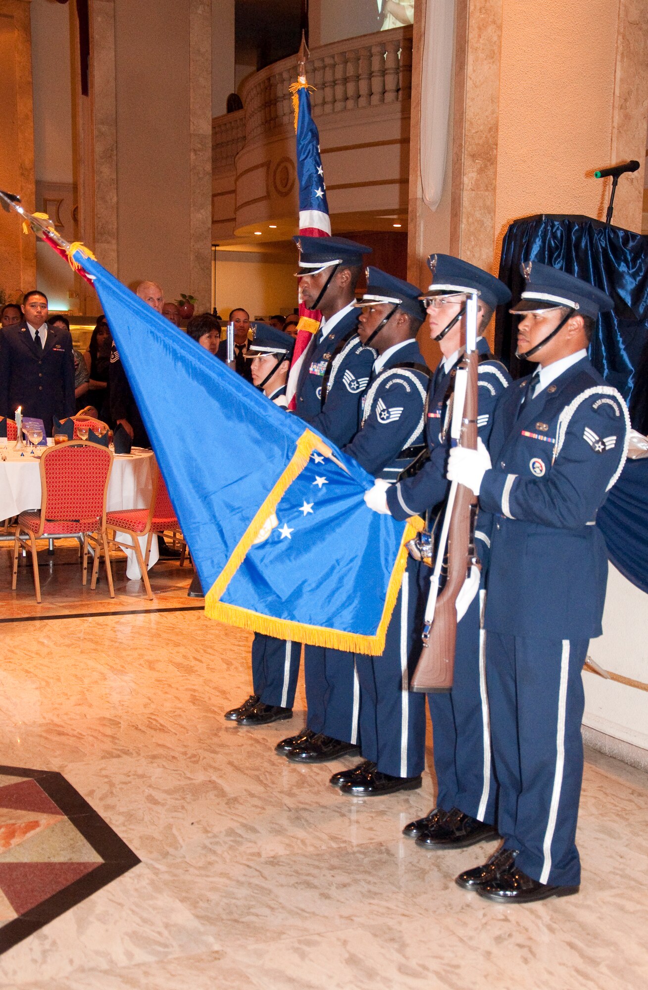 Members of the Andersen AFB Honor Guard post the colors at the 44th Aerial Port Squadron's 30th Anniversary Banquet, March 26, at the Holiday Resort and Spa, Tumon, Guam. (U.S. Air Force Photo/Staff Sgt. Erin Smith)