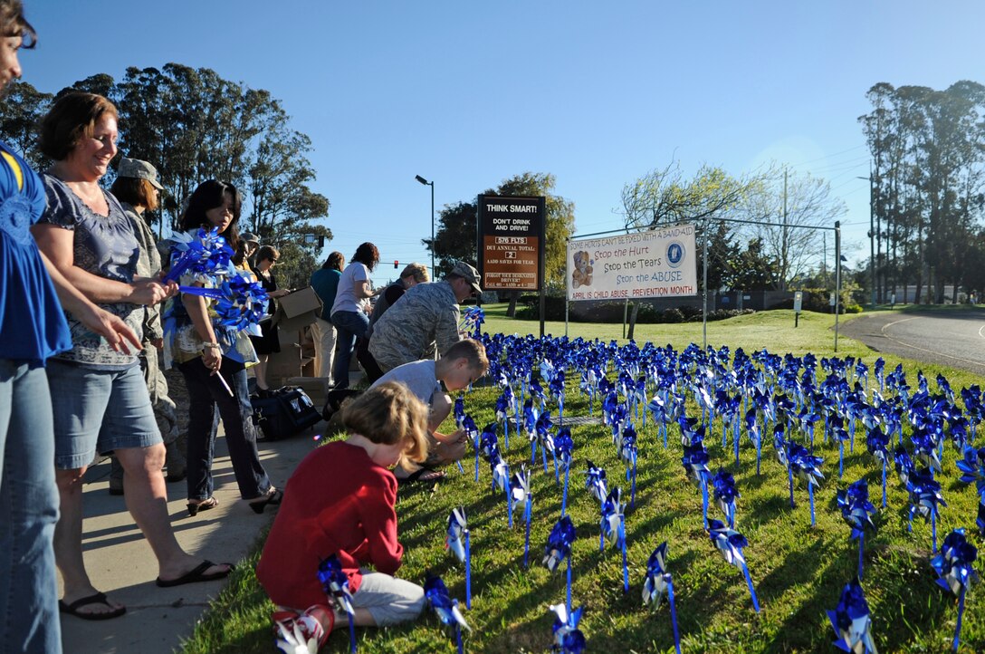 VANDENBERG AIR FORCE BASE, Calif. – Members of Team V supported April’s Child Abuse Awareness Month by placing 576 blue and silver pinwheels into the ground outside the main gate here Friday, April 1, 2011. The pinwheel garden is meant to visually remind people of the very real threat and need for child abuse prevention. (U.S. Air Force photo/Senior Airman Lael Huss)