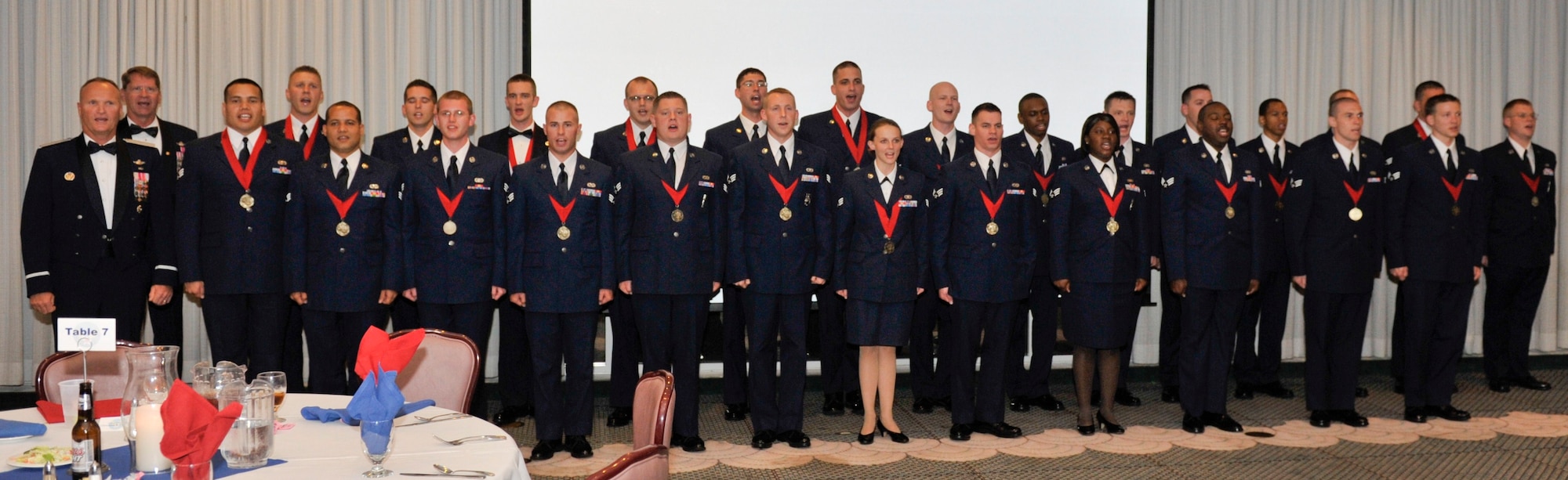 Airman Leadership School's graduating class 11-3 sings the Air Force Song at the Heritage Club March 31 as their graduation ceremony commences. (U.S. Air Force photo by Jonathan Gibson)