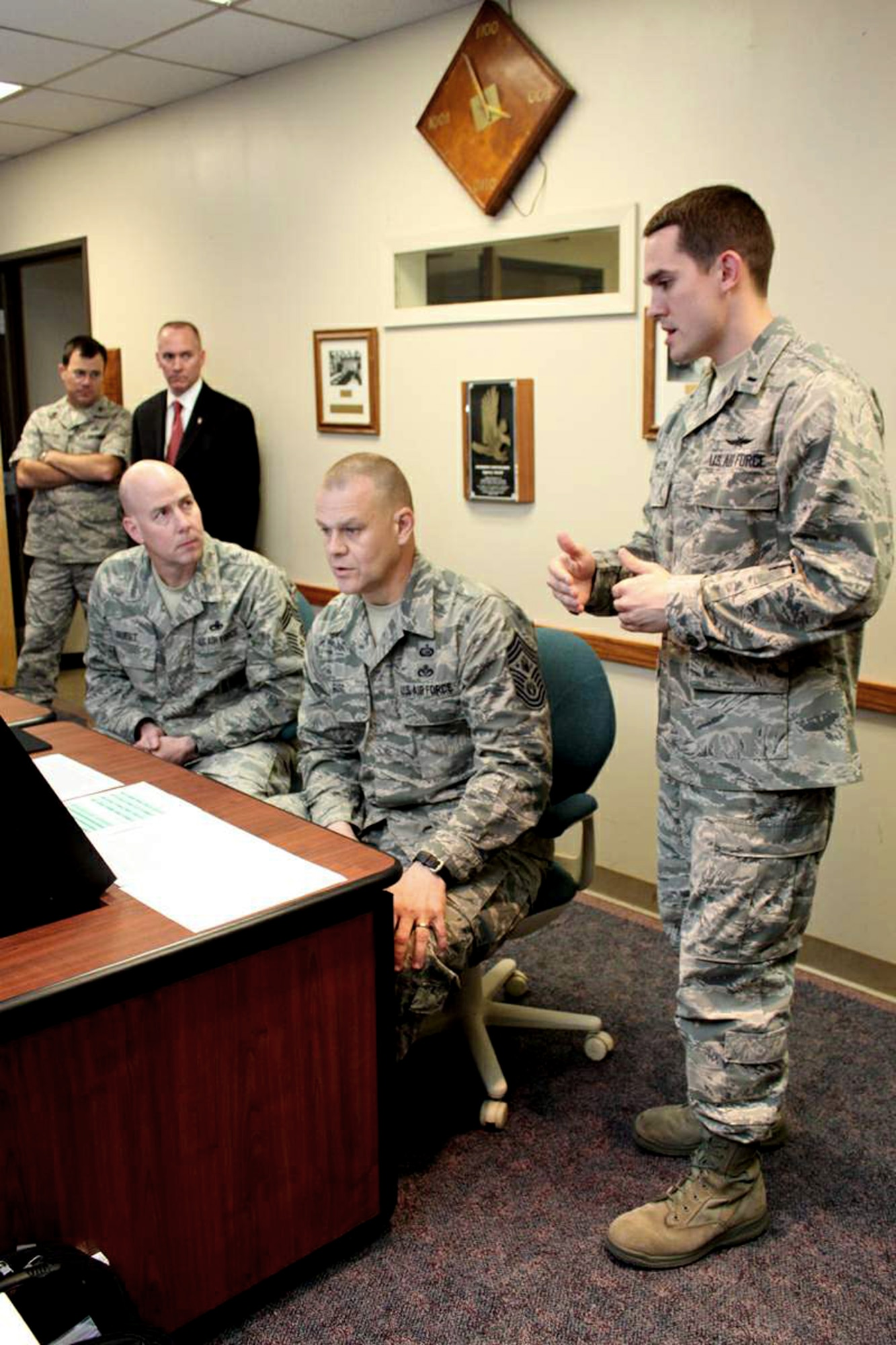 1st Lt. Stephen Lawson explains the new enlisted development tool to Chief Master Sgt. of the Air Force James A. Roy and Chief Master Sgt. Ray Guest, the Air Force's nuclear weapons career field manager, March 31, 2011, at Randolph Air Force Base, Texas. Lawson is the Air Force Personnel Center's force development chief. (U.S. Air Force photo/Tech. Sgt. Steve Grever)