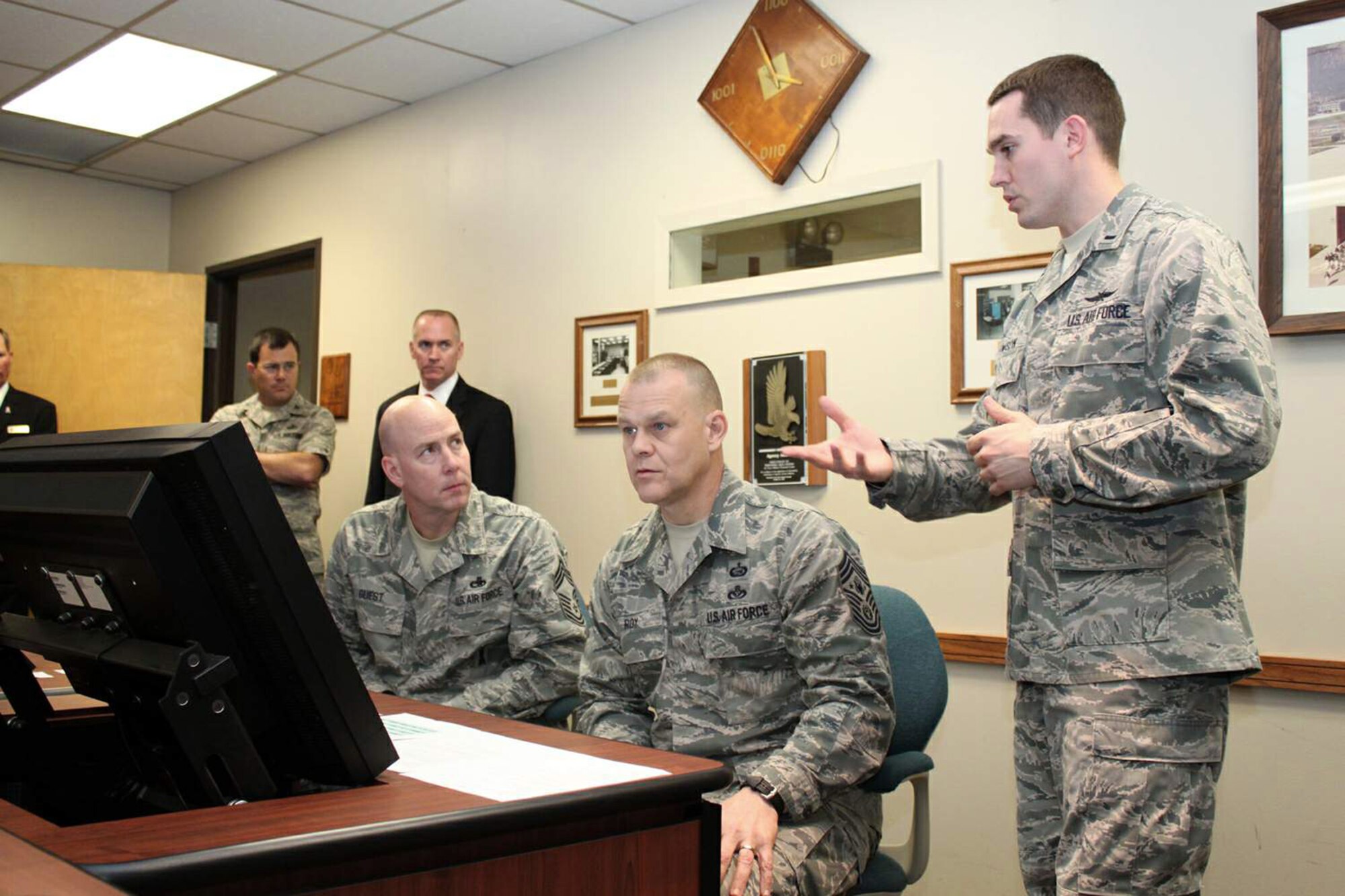 1st Lt. Stephen Lawson explains the new enlisted development tool to Chief Master Sgt. of the Air Force James A. Roy and Chief Master Sgt. Ray Guest, the Air Force's nuclear weapons career field manager, March 31, 2011, at Randolph Air Force Base, Texas. Lawson is the Air Force Personnel Center's force development chief. (U.S. Air Force photo/Tech. Sgt. Steve Grever)