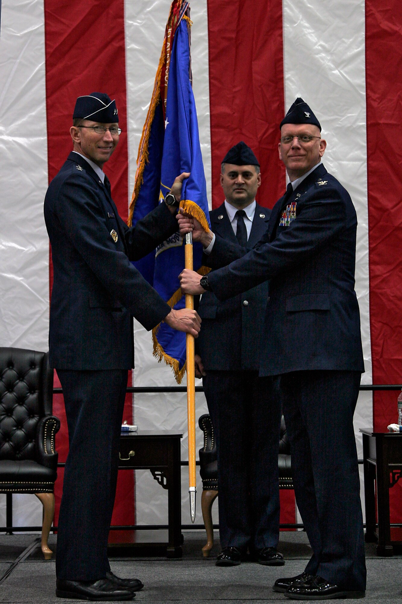 JOINT BASE MCGUIRE-DIX-LAKEHURST, N.J. -- Col. Michael J. Underkofler (right) assumes command of the 514th Air Mobility Wing upon receiving the wing guidon from Maj. Gen. James Rubeor, 22nd Air Force commander, at a change-of-command ceremony here March 27, 2011. Colonel Underkofler has previously served as the wing's vice commander, the chief of staff of the 22nd AF and the commander of the 908th Airlift Wing. (U.S. Air Force Photo/Tech. Sgt. Carlos Aponte)