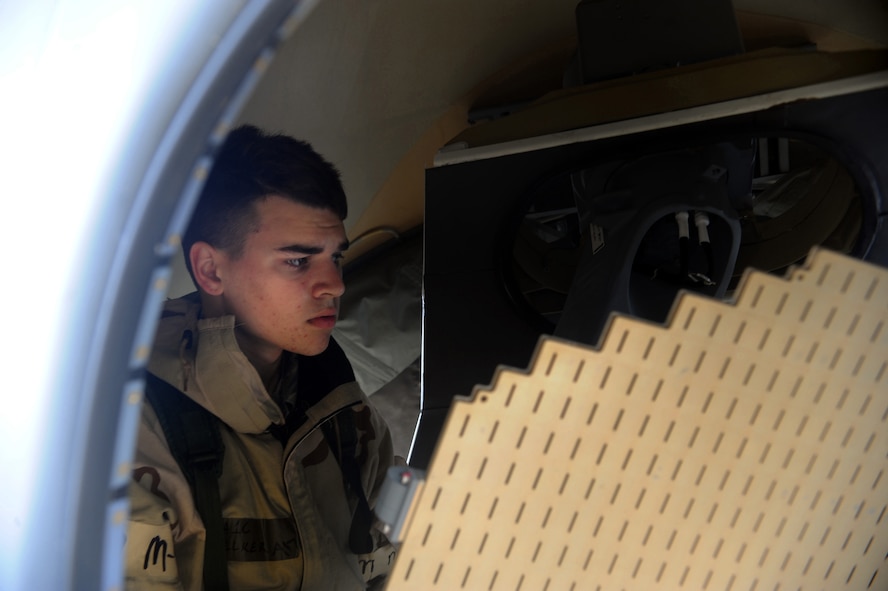 Airman 1st Class Cody Eoelker, 723rd Aircraft Maintenance Squadron communications/navigation mission systems specialist, works on a HC-130P Combat King March 31 at Moody Air Force Base, Ga. Airman Eoelker prepared the aircraft for the installation of a new radar system. (U.S. Air Force photo/Airman 1st Class Douglas Ellis)(RELEASED)