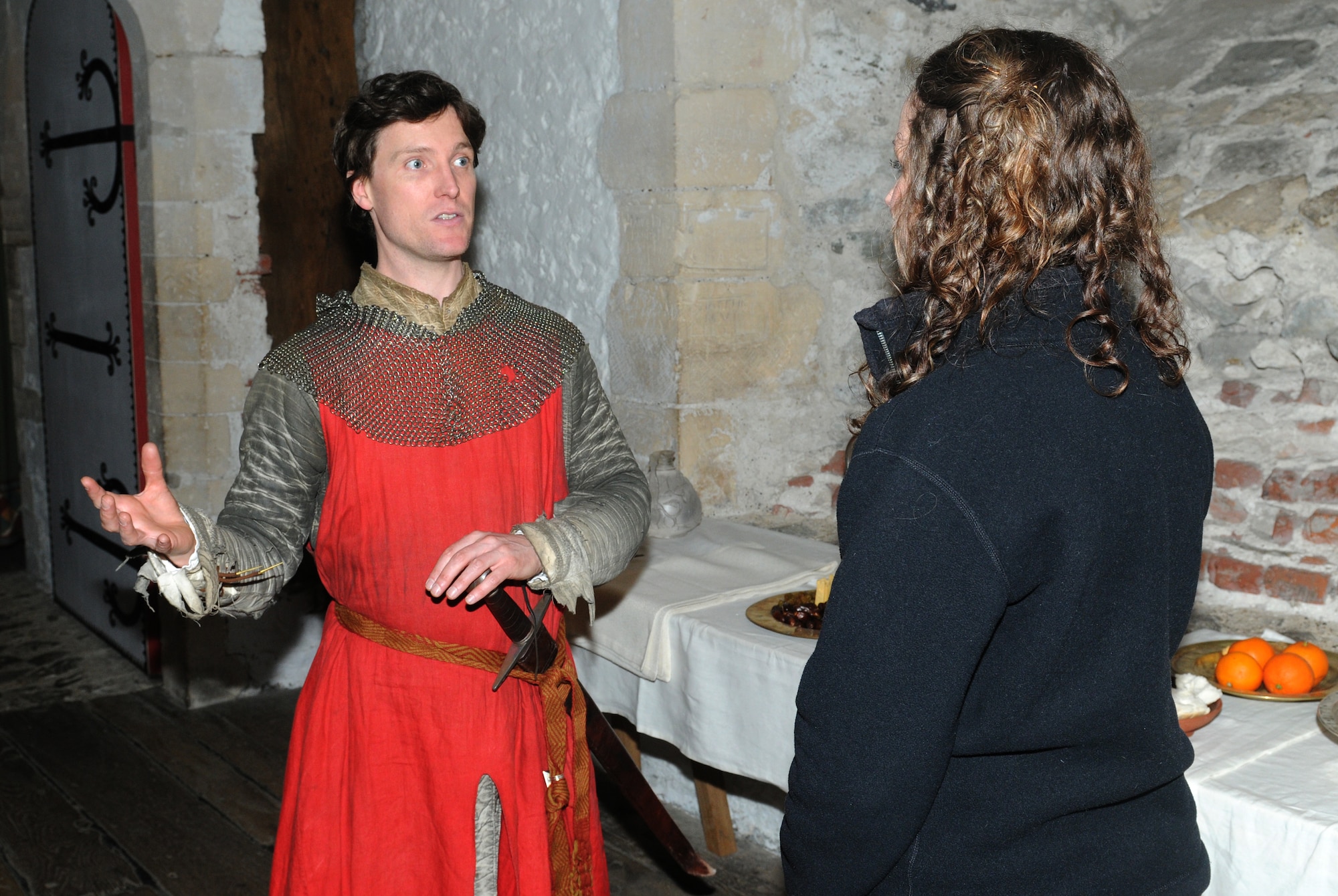 DOVER, England – One of Dover Castle’s characters speaks to an RAF Lakenheath Information Tickets and Travel trip participant in the guest dining hall inside the Great Tower on March 26, 2011. Dover Castle has a variety of characters on site to explain the castle’s history. (U.S. Air Force photo/Staff Sgt. Stephen Linch)