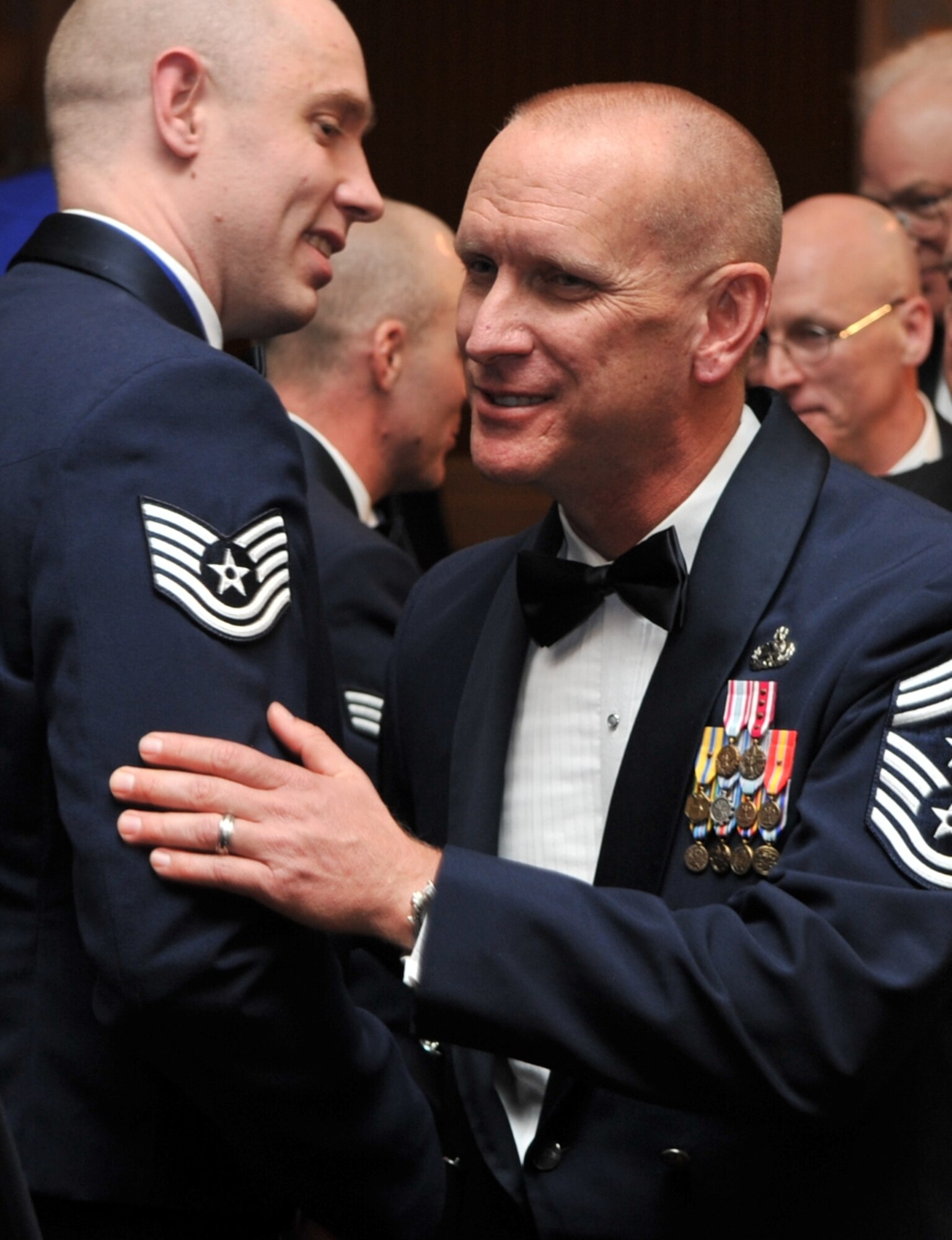 Chief Master Sgt. Brian Hornback, command chief for Air Force Global Strike
Command, congratulates Outstanding Non-Commissioned Officer of the Year,
Tech. Sgt. Bradley Williams, the acting first sergeant for the 5th Logistics
Readiness Squadron at Minot Air Force Base, N.D. Sergeant Williams was
recognized at the command's Outstanding Airmen of the Year banquet in
Shreveport, La., March 24. The Airmen will go on to compete at Air Force
level to become the 12 Outstanding Airmen of the Year.  (U.S. Air Force
photo/Airman 1st Class Micaiah Anthony)
