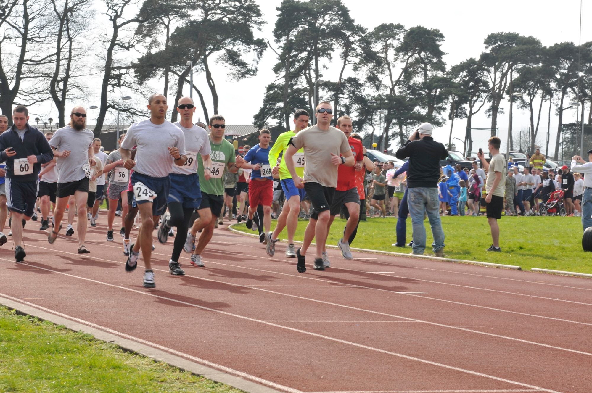 ROYAL AIR FORCE LAKENHEATH, England – Airmen, families and pets participate in the Phil Myers Memorial Run on April 1, 2011. Sergeant Myers was a member of the 48th Civil Engineer Squadron Explosive Ordnance Disposal Flight who died as a result of an improvised explosive attach while deployed to Afghanistan in 2009. (U.S. Air Force photo/Senior Airman Tiffany M. Deuel)