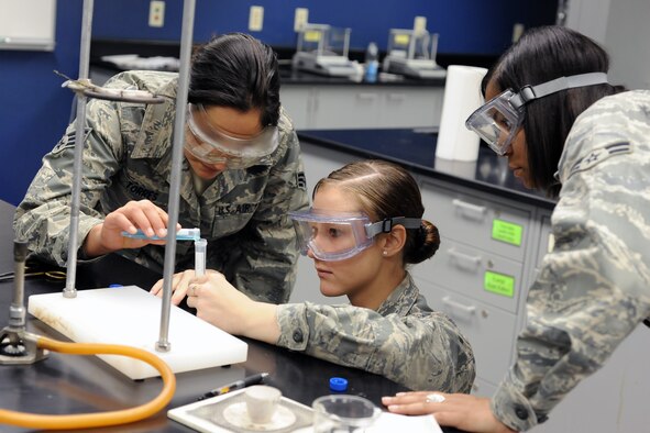 Cadet 4th Class Chelsea Renfro, CS-14, performs a chemistry
expirement during a Leaders Encouraging Airmen Development conference.
Enlisted Airmen make up 50 spots in each preparatory school class.
ABOVE: Col. William Walker, vice director of athletics, addresses Prep School candidates. (Photo by Rachel Boettcher)