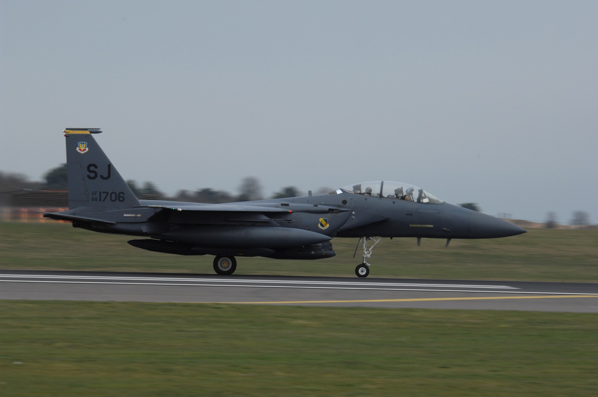 ROYAL AIR FORCE LAKENHEATH, England - An F-15E Strike Eagle from the 4th Fighter Wing at Seymour Johnson Air Force Base, N.C., rolls for departure RAF Lakenheath, England, March 26, 2011.  The aircraft stopped at Lakenheath on their way home from a regularly scheduled deployment to Southwest Asia. (U.S. Air Force photo by Tech. Sgt. Lee A. Osberry Jr.)