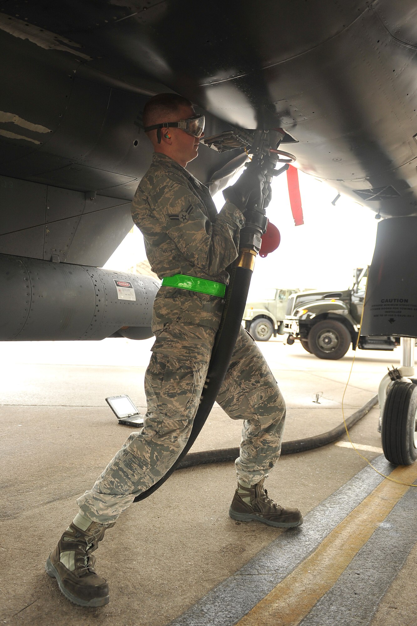 SEYMOUR JOHNSON AIR FORCE BASE, N.C. – Airman 1st Class Dane Reynolds connects a fuel hose to an F-15E Strike Eagle jet here, March 31, 2011. Airman Reynolds is fueling a jet for a flyover demonstration using environmentally safe fuel. U.S. Air Force leadership made a commitment to use alternative fuels and collect additional performance and flight information. Airmen from Seymour Johnson will complete the first biomass-fueled flyover at the Philadelphia Phillies season opener April 1. Airman Reynolds is a 4th Aircraft Maintenance Squadron crew chief and a native of Indianapolis. (U.S. Air Force photo/Senior Airman Whitney Lambert) (RELEASED)