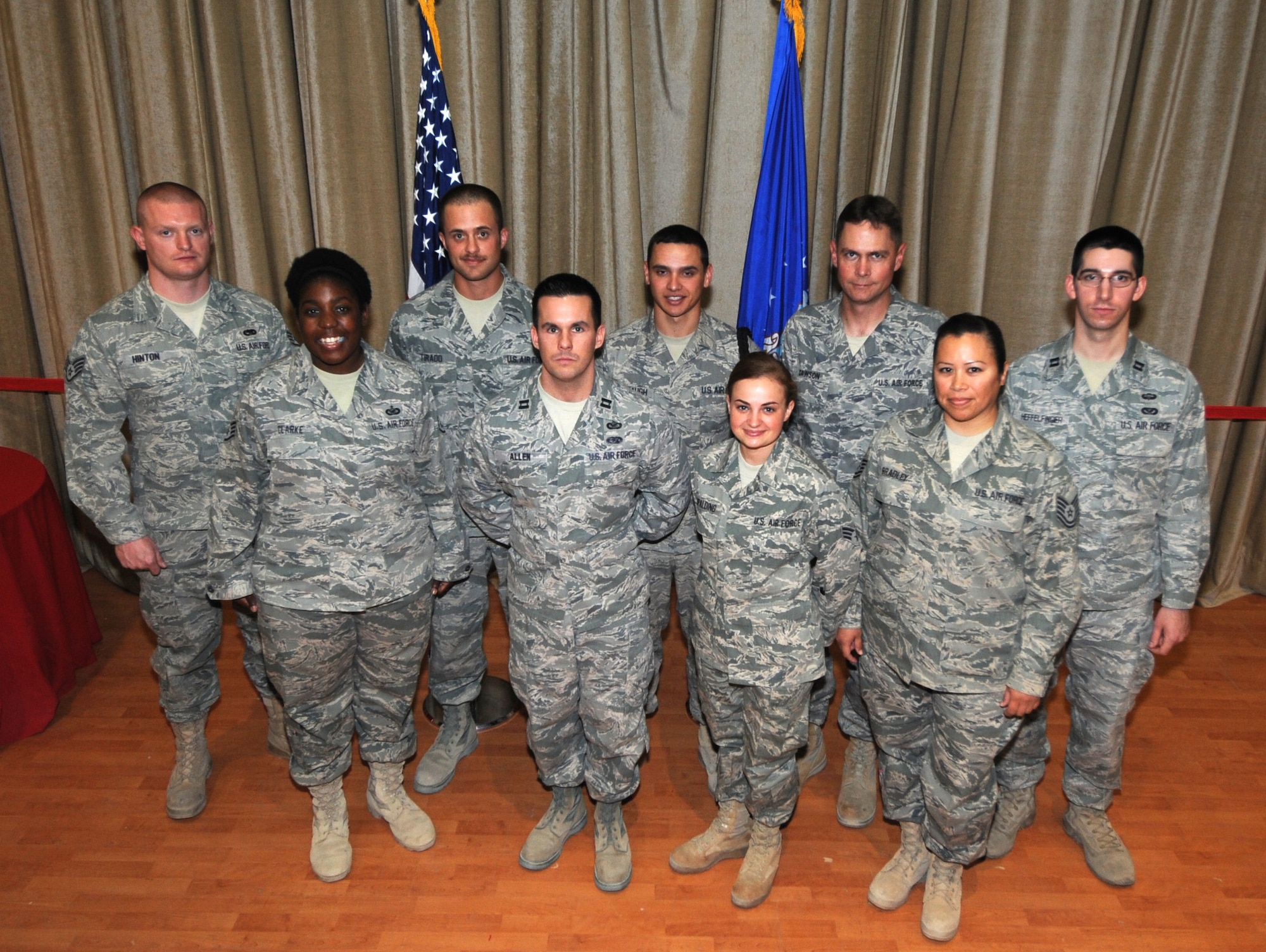 Front row, from left: Staff Sgt. Patrice Clarke, Capt. Heath Allen, Senior Airman Cynthia Spalding and Tech Sgt. Sandra Bradley, all members of the 386th Air Expeditionary Wing Public Affair Office, which was named the wing?s Team of the Month. Back row, from left: Staff Sgt. Thomas L. Hinton, Noncommissioned Officer of the Month; Senior Airman Antonio M. Tirado, Airman of the Month; Airman First Class Daniel R. Middaugh, Honor Guardsman of the Month; Master Sgt. Roger C. Dawson, Senior NCO of the Month; Capt. Mark T. Heffelfinger, Company Grade Officer of the Month.
