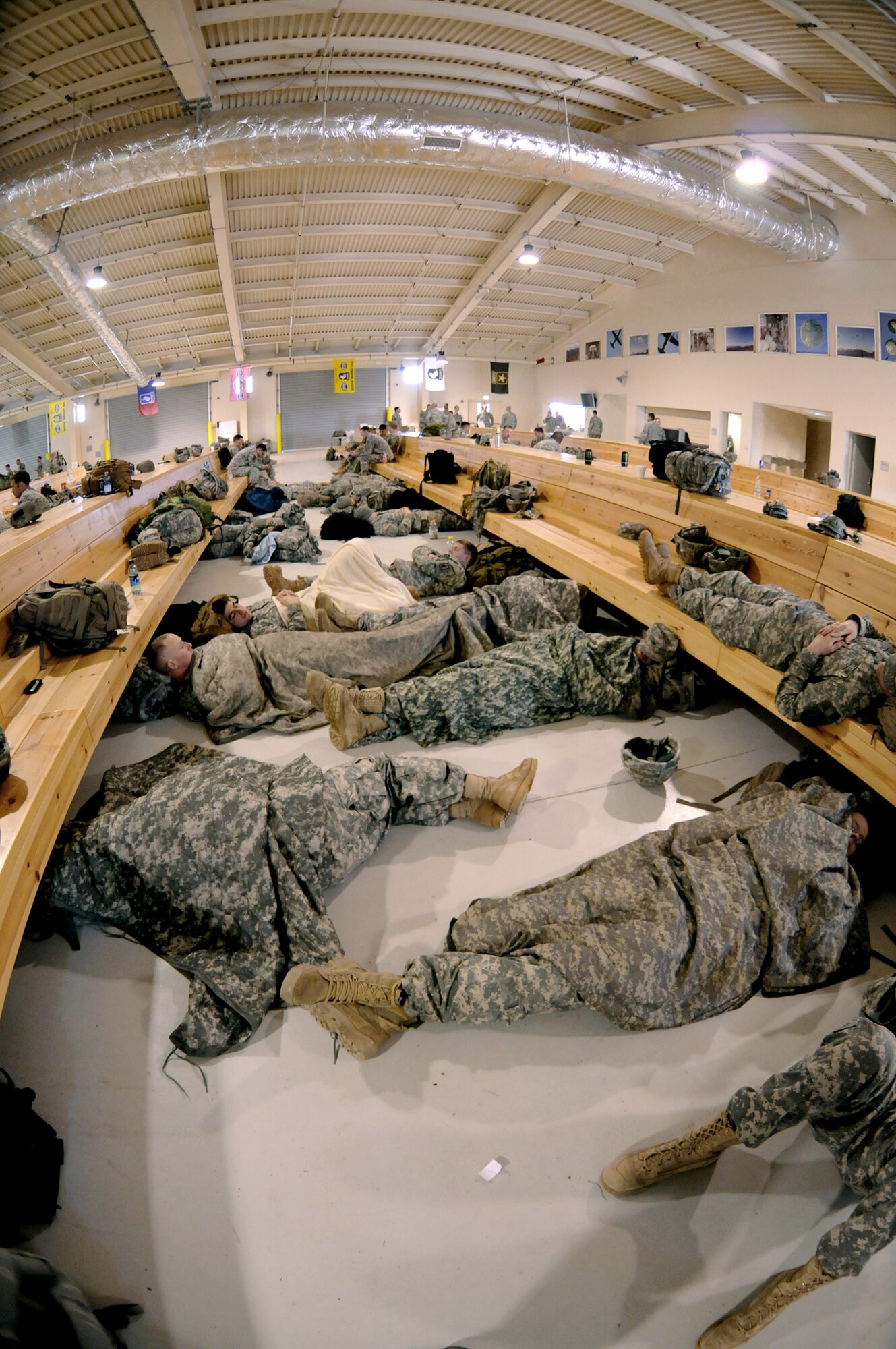 Members of the U.S. Army 173rd Airborne Brigade Combat Team rest after they jumping from a C-17 Globemaster III during a joint coalition training exercise March 23. More than 1,400 personnel from the 173rd Airborne Brigade Combat Team, the 8th ASOS and Italian army paratroopers participated in the weeklong event. ( U.S. Air Force photo/ Airman Briana N. Jones)
