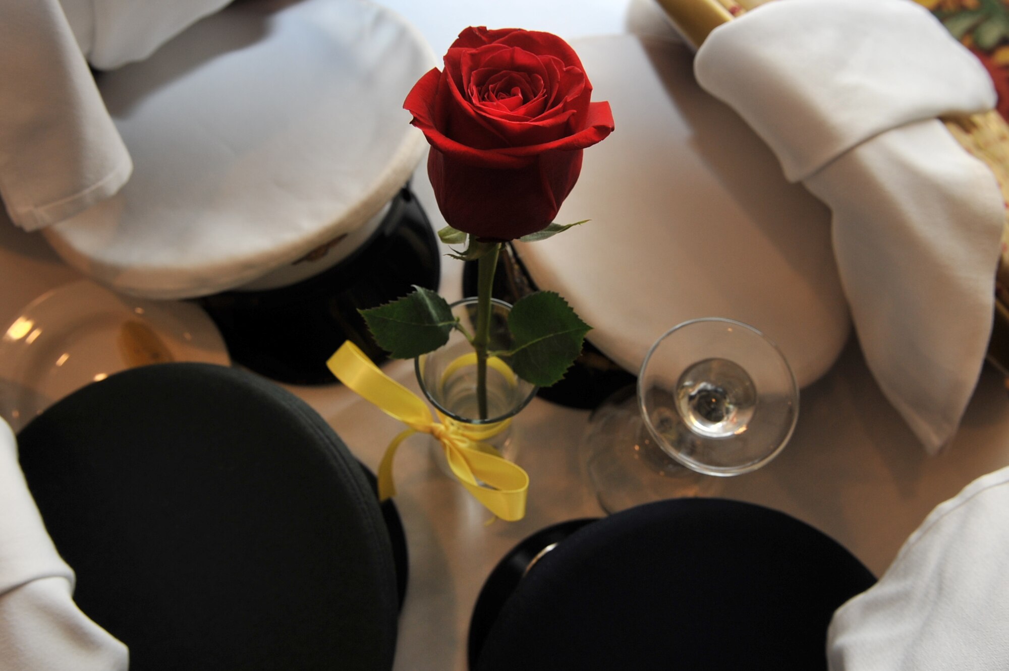 Four service caps represent each branch of the military services for the
Prisoner of War/Missing in Action table during the Air Force Global Stike
Command Outstanding Airman of the Year banquet March 24 in Shreveport, La.
The table is set to honor our Nation's POW/MIA Airmen, Soldiers, Sailors and
Marines past and present. (U.S. Air Force photo/Airman 1st Class Micaiah
Anthony)