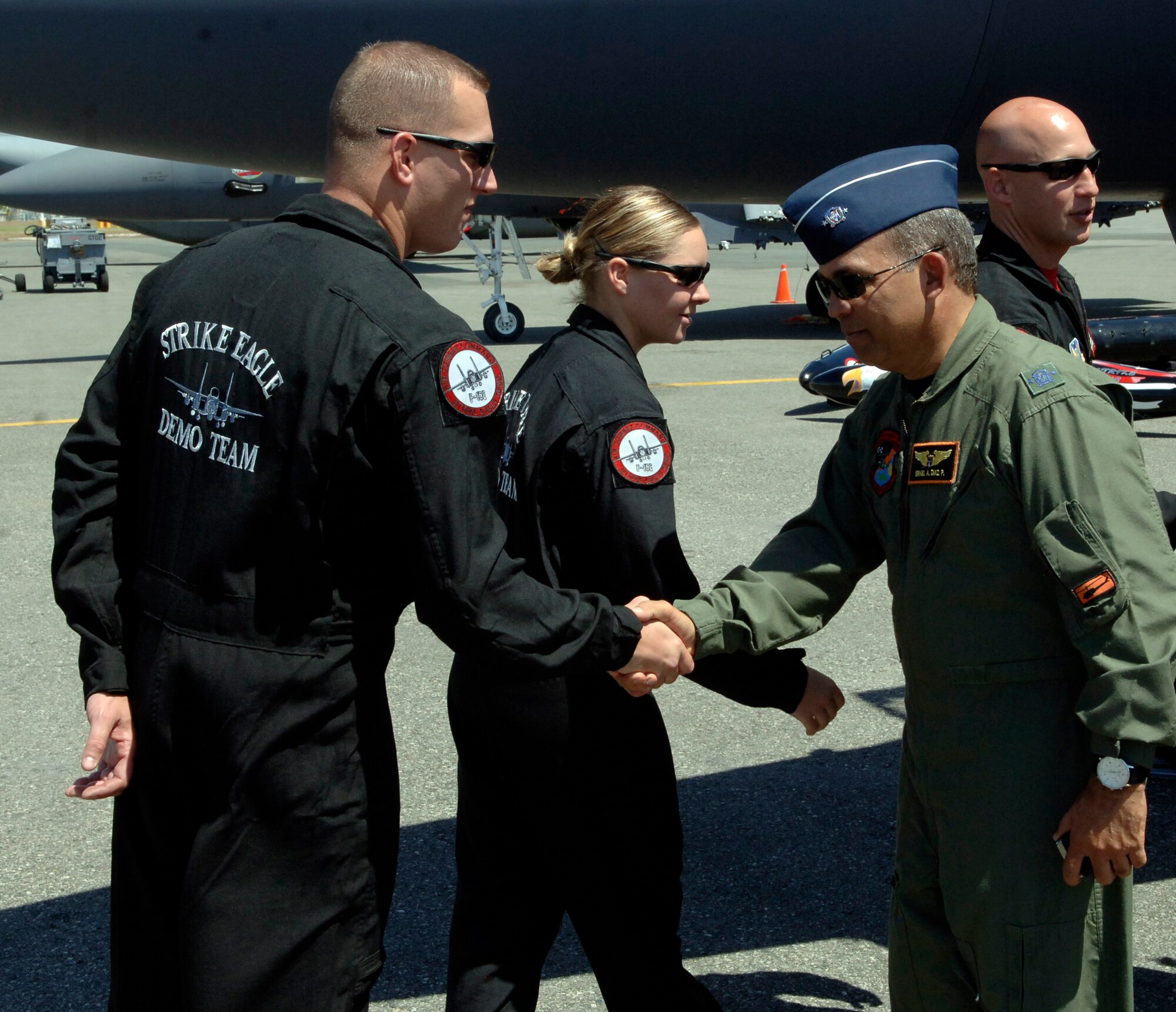 Staff Sgt. Craig Wyman (left), F-15E Demo Team maintainer, greets Dominican Republic Air Force Chief of Staff Maj. Gen. Israel Diaz during The Great Air Show Mar. 26 in Santo Domingo. (U.S. Air Force photo/Tech. Sgt. Eric Petosky)