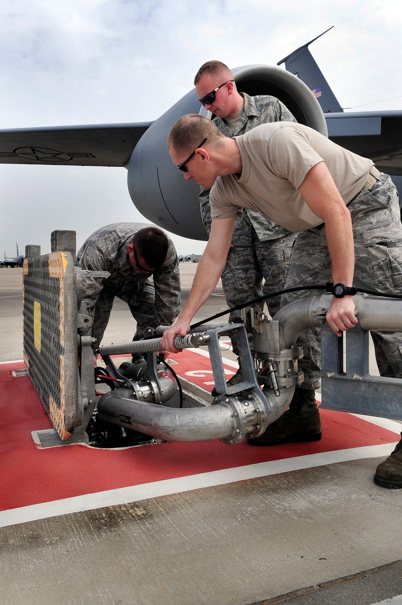 Airmen from the 100th Logistics Readiness Squadron work a pantograph into place to attach it to an underground fuel source to refuel a KC-135 Stratotanker March 25, 2011, at Ramstein Air Base, Germany, in support of Joint Task Force Odyssey Dawn. Joint Task Force Odyssey Dawn is the U.S. Africa Command task force established to provide operational and tactical command and control of U.S. military forces supporting the international response to the unrest in Libya and enforcement of United Nations Security Council Resolution 1973. (U.S. Air Force photo/Senior Airman Ethan Morgan)