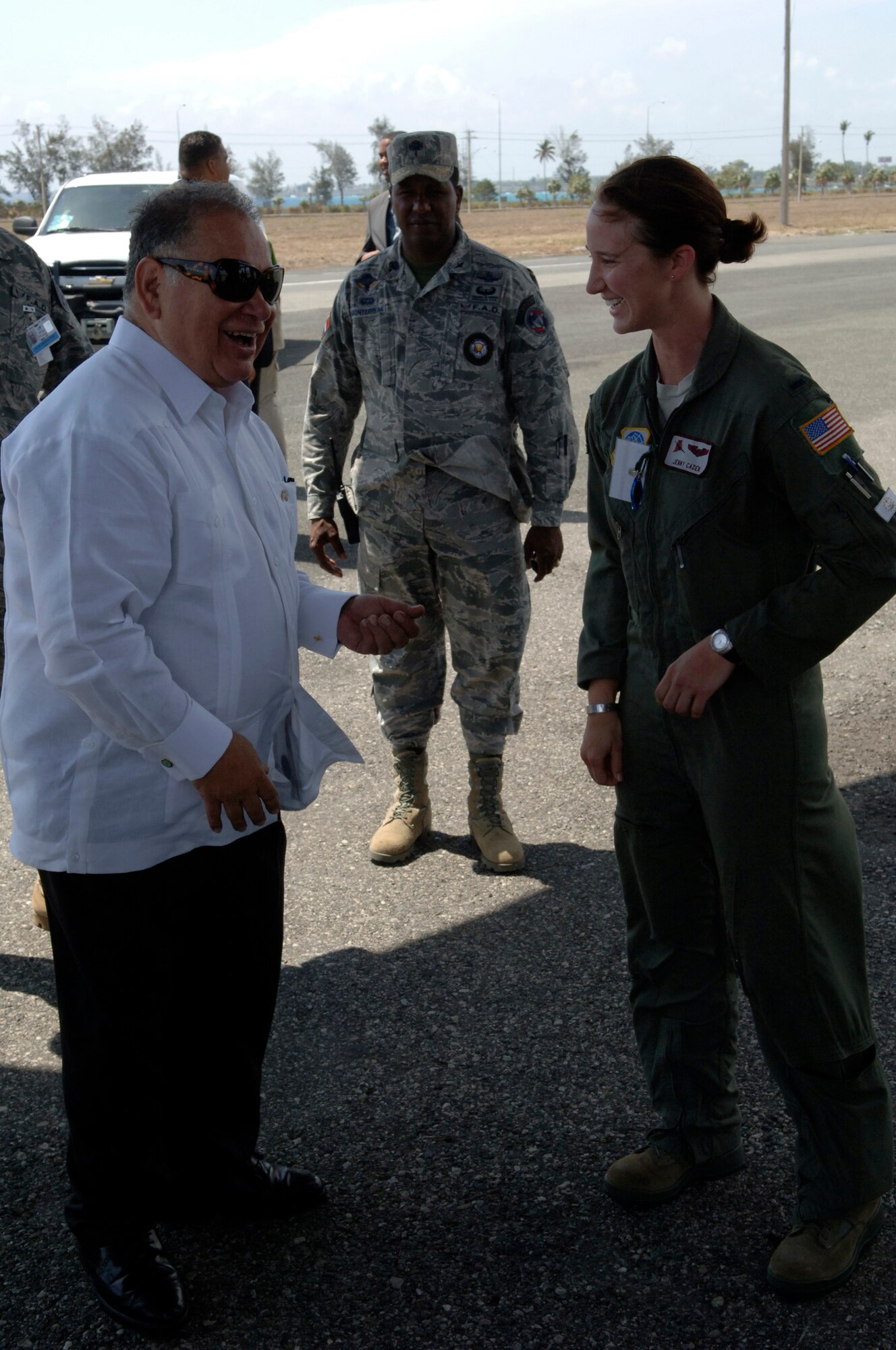 U.S. Ambassador to the Dominican Republic Raul Yzaguirre (left) speaks with 1st Lt. Jenny Caden during a tour of Air Force aircraft supporting The Great Air Show on Mar. 27. Lieutenant Caden is a C-130J pilot with the Rhode Island Air National Guard. (U.S. Air Force photo/Tech. Sgt. Eric Petosky)