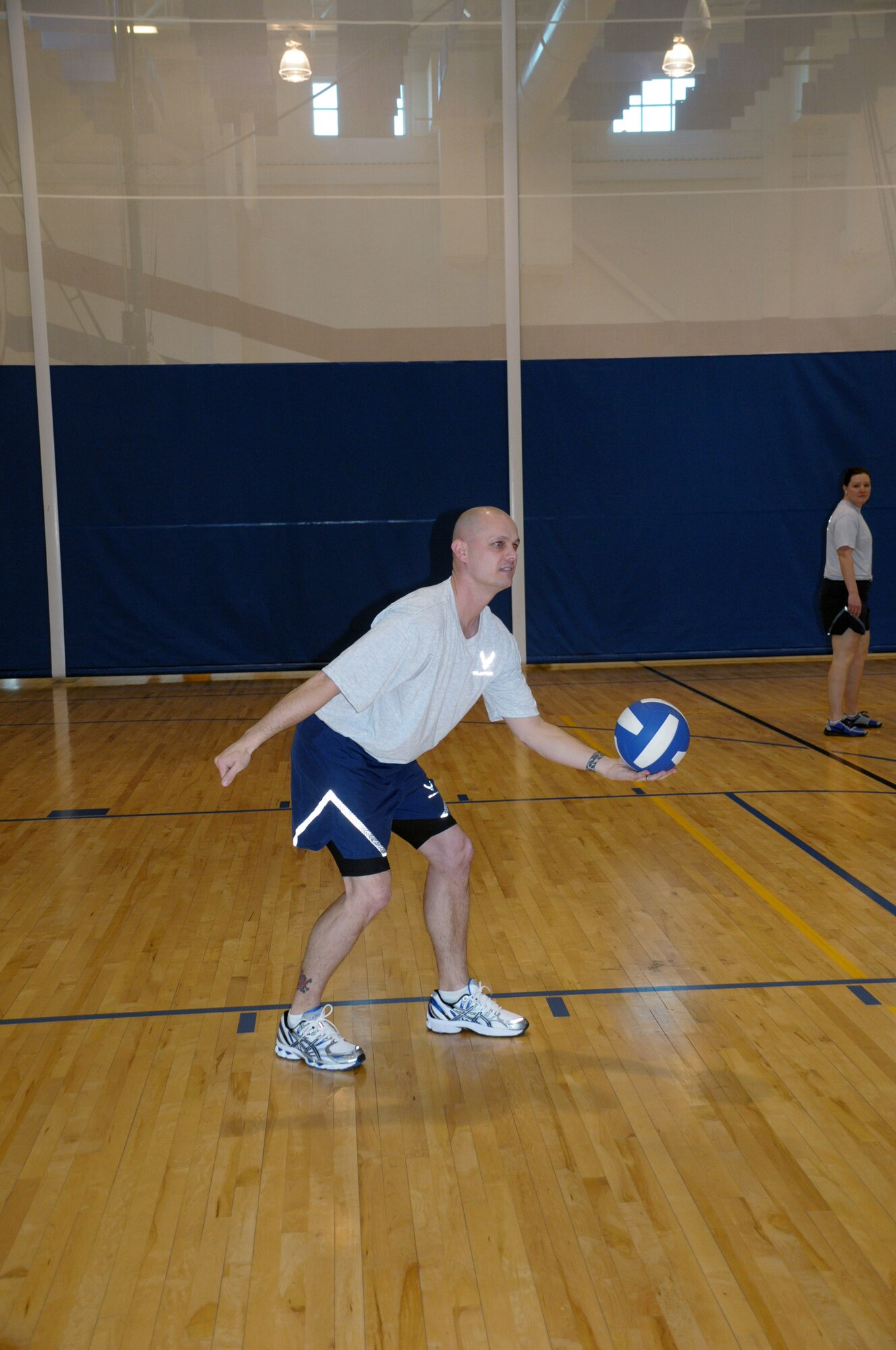 Master Sgt. Stephen Hart, 90th Civil Engineer Squadron First Sergeant, prepares to serve the ball during a volleyball game for squadron PT session in the Freedom Hall Fitness Center. (U.S. Air Force photo by Blaze Lipowski)
