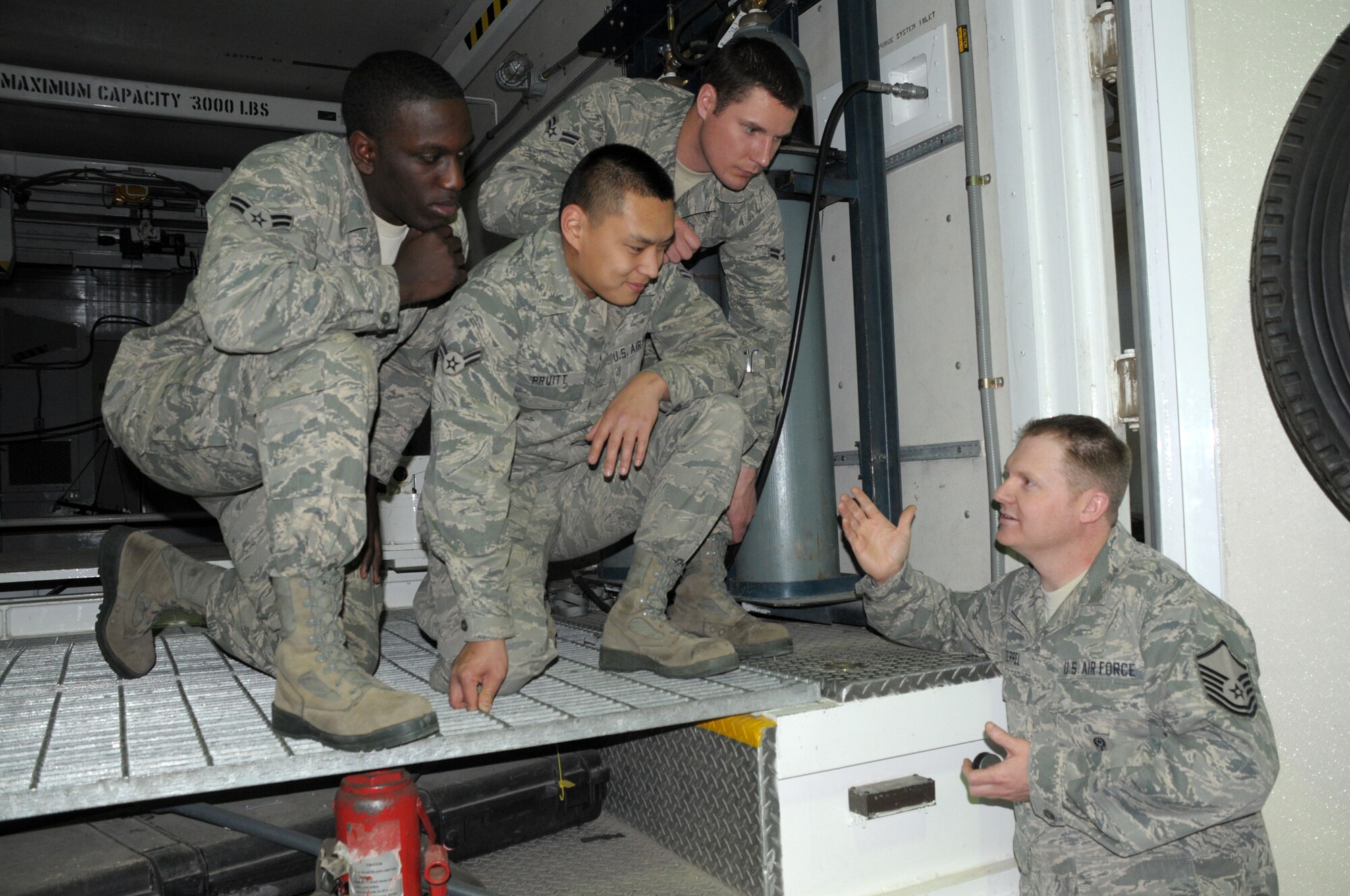 Master Sgt. Tyler Terrel, 90th Missile Maintenance Squadron, briefs Airman 1st Class David Gilbert,  Adam Pruitt and Charles Hafer, all from 90th MMXS, before a trip to the missile field. (U.S. Air Force photo by Blaze Lipowski)

