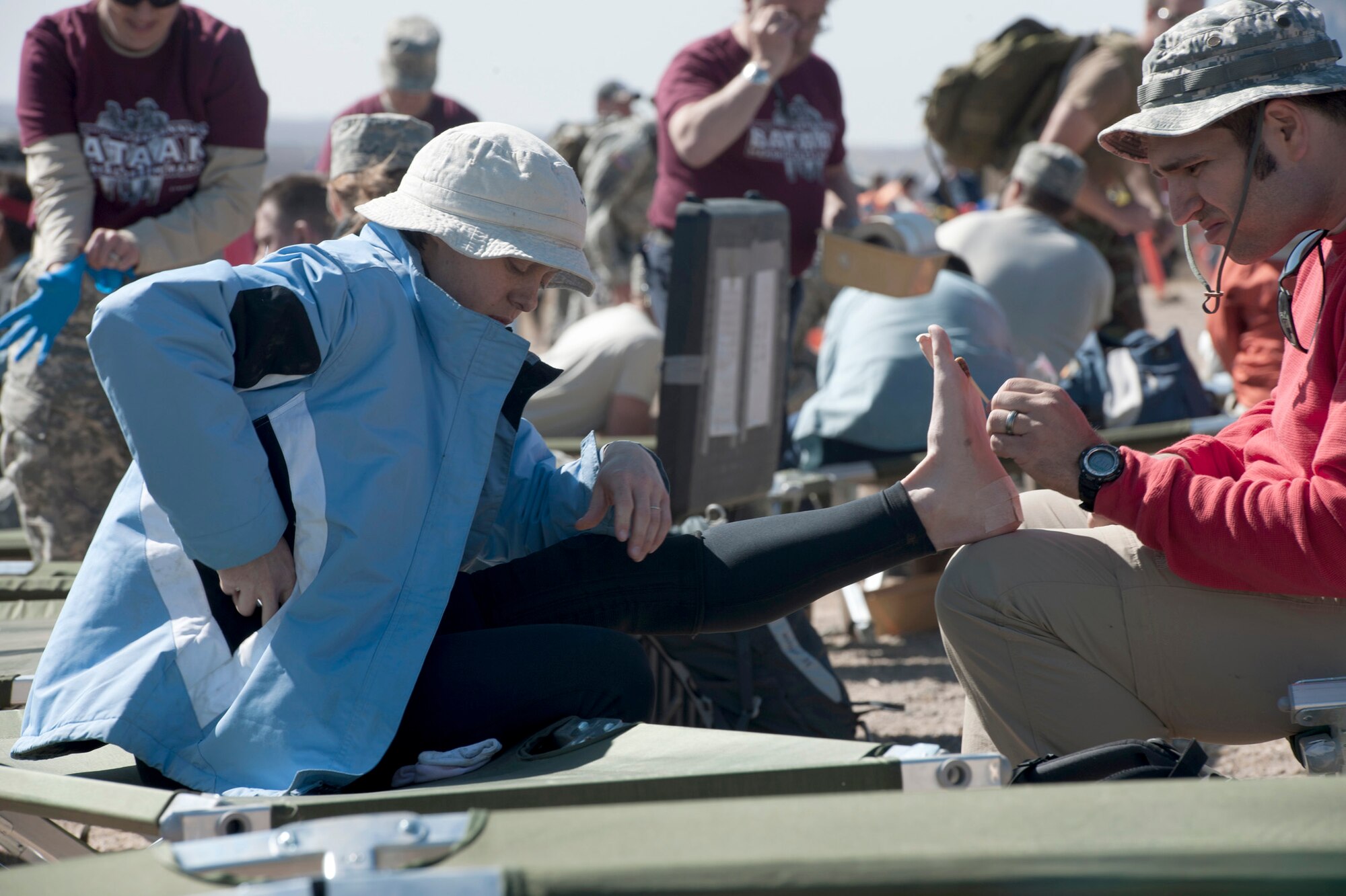 A participant of the 22nd Annual Bataan Memorial Death March receives medical attention March 27, 2011at one of seven medical stations along the 26.2-mile trail at White Sands Missile Range, New Mexico. Marchers trekked through rough terrain at elevations ranging between 4,100 and 5,300 feet. The event, attended by a record number of more than 6,000 marchers, commemorated the original Bataan Death March, which occurred in the Philippines during World War II. (U.S. Air Force photo/Airman 1st Class Joshua Turner)