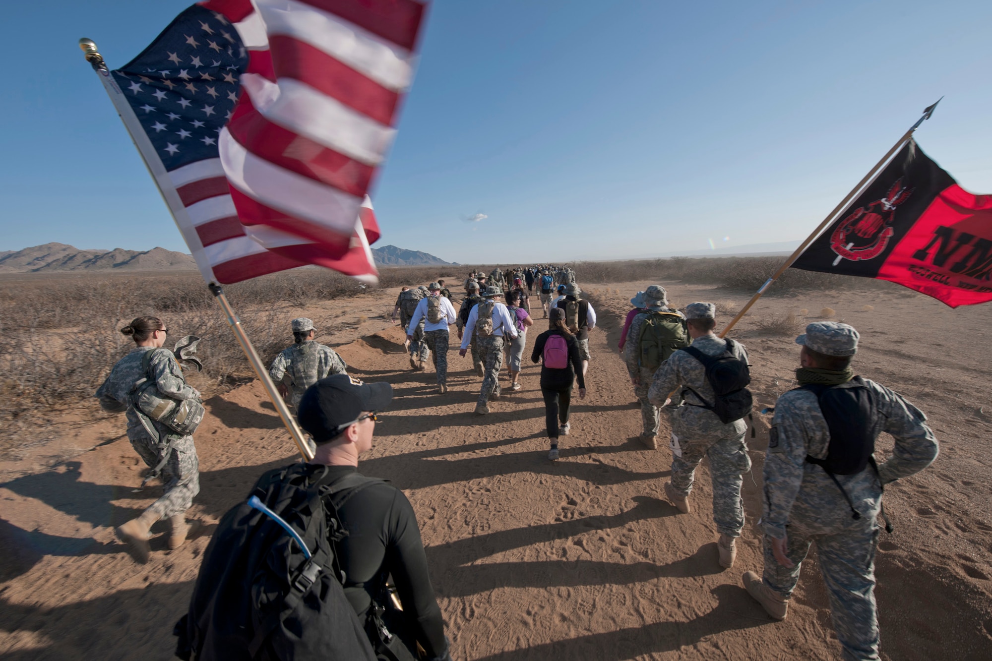 Participants of the 22nd Annual Bataan Memorial Death March trek through the 26.2-mile desert trail March 27, 2011, at White Sands Missile Range, New Mexico. The event, attended by a record number of more than 6,000 marchers, commemorated the original Bataan Death March, which occurred in the Philippines during World War II. (U.S. Air Force photo/Airman 1st Class Joshua Turner) 

