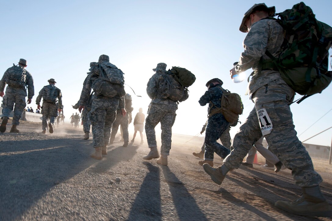 Participants of the 22nd Annual Bataan Memorial Death March imprint their footprints on the 26.2-mile desert trail March 27, 2011, at White Sands Missile Range, New Mexico. The event, attended by a record number of more than 6,000 marchers, commemorates the original Bataan Death March which occurred in the Philippines during World War II. On April 9, 1942, 75,000 Army, Army Air Corps, Navy, Marines and Filipino soldiers were surrendered to Japanese forces. Forced to march 60 miles in the sweltering heat through the Philippine jungles, thousands of soldiers died in transit to prisoner-of-war camps. (U.S. Air Force photo/Airman 1st Class Joshua Turner) 