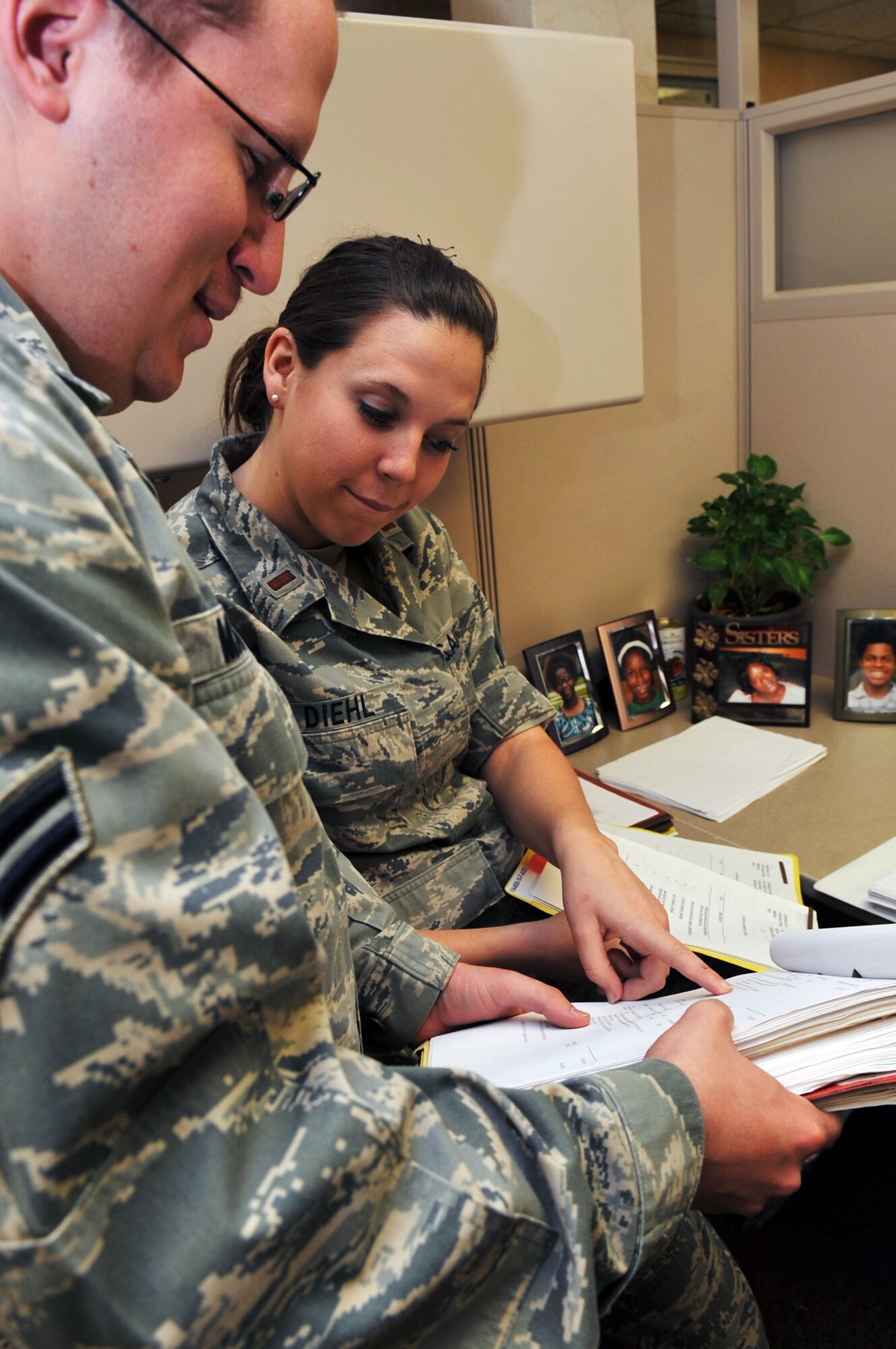 Airman 1st Class Michael Madison, 2nd Contracting Squadron commodities contracting specialist and 2d Lt. Kaila Diehl, 2 CONS contract administrator, review contract files at Barksdale Air Force Base, La., April 1. By gaining experience in contracting and performing acquisitions, Airmen in this career field have the opportunity to work in many different aspects of business in the civilian world. (U.S. Air Force photo/Senior Airman Brittany Y. Bateman)(RELEASED)