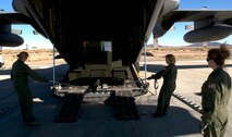 Unheard thirty five years ago when the 133rd Airlift Wing deployed to Yuma in Feb. 1976  women now occupy many of the same roles as men in the Air Force including the role of Loadmaster.  A all female group of Loadmasters unloads a generator from the back of a 133rd Airlift Wing, Minnesota Air National Guard C-130 Hercules cargo aircraft 27 Feb, 2011 Yuma Proving Ground Yuma, Ariz. U.S. Air Force photo by Tech. Sgt. Erik Gudmundson