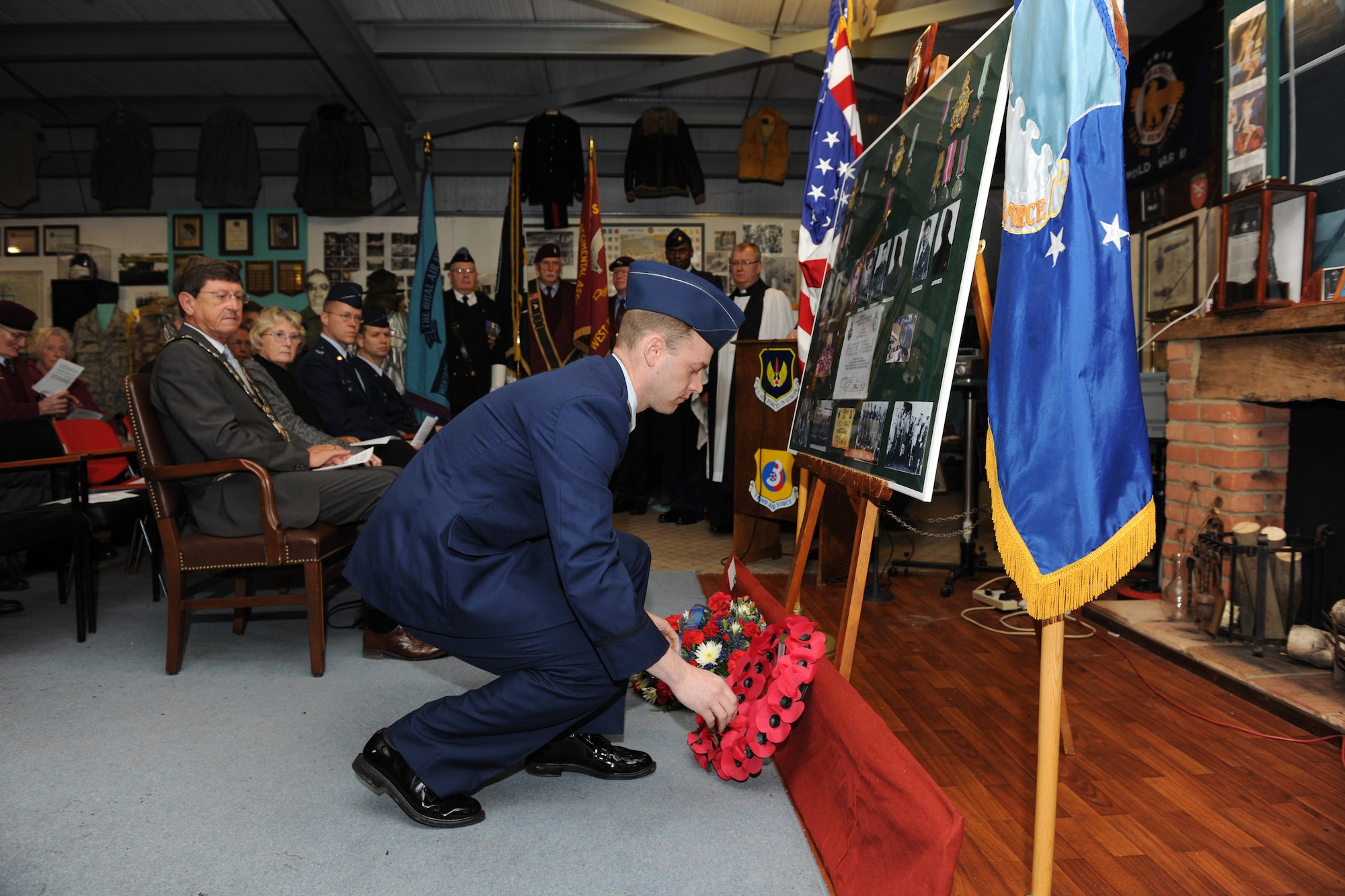 RAF WELFORD, United Kingdom - Capt. Kurt Umlauf, 420th Munitions Squadron commander, presents a wreath at the memorial service for eight Airmen attached to the Royal Air Force's 101st Squadron March 31 here, 67 years after their Lancaster Bomber crashed here. (U.S. Air Force photo by Tech. Sgt. John Barton)