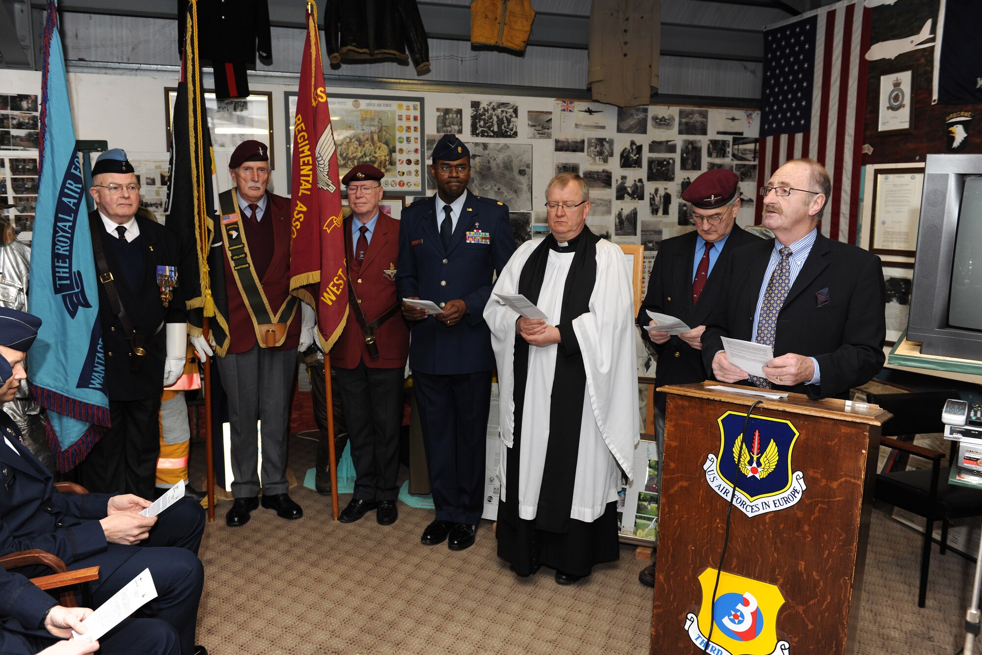 RAF WELFORD, United Kingdom - Alan Bovingdon-Cox (far right), Ridgeway Military and Aviation Research Group president, begins the memorial service for eight Airmen attached to the Royal Air Force's 101st Squadron March 31 here, 67 years after their Lancaster Bomber crashed here. (U.S. Air Force photo by Tech. Sgt. John Barton)