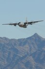 A C-130 Hercules cargo aircraft from the 133rd Airlift Wing makes a low level approach just prior to a LCLA drop Feb. 28, 2011 at Yuma Proving Ground, Yuma, Ariz. During the week of Feb. 28th, 2011 Airmen and the C-130 Hercules of the 133rd Airlift Wing, Minnesota Air National Guard deployed for training to Yuma Proving Ground where they practiced Low-Cost Low-Altitude airdrops. This knowledge and experience will be directly applied during deployment to Afghanistan. The LCLA bundles are more accurate and use expendable parachutes weighing in at 80 to 500 pounds. LCLA is well suited for small units on patrol or in remote outposts where they don't have the equipment or manpower to deal with the larger container delivery system bundles. U.S. Air Force photo by Tech. Sgt. Erik Gudmundson
