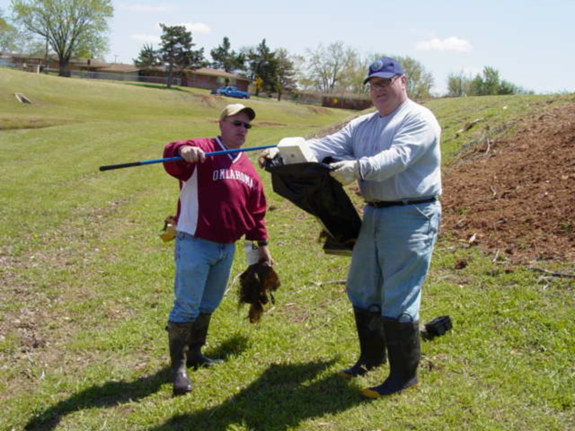 Ray Moody and Tim Taylor from 72nd Civil Engineer Directorate collect trash at Crutcho Creek during last year’s Spring Creek Cleanup.  Spring Creek Cleanup is part of Tinker’s Earth Month Activities to promote environmental awareness throughout the base. The 72nd ABW Civil Engineer Directorate is looking for volunteers to collect trash along the corridors of creek systems on base again this year.  The clean-up event is planned for 1 to 4 p.m. April 8.  