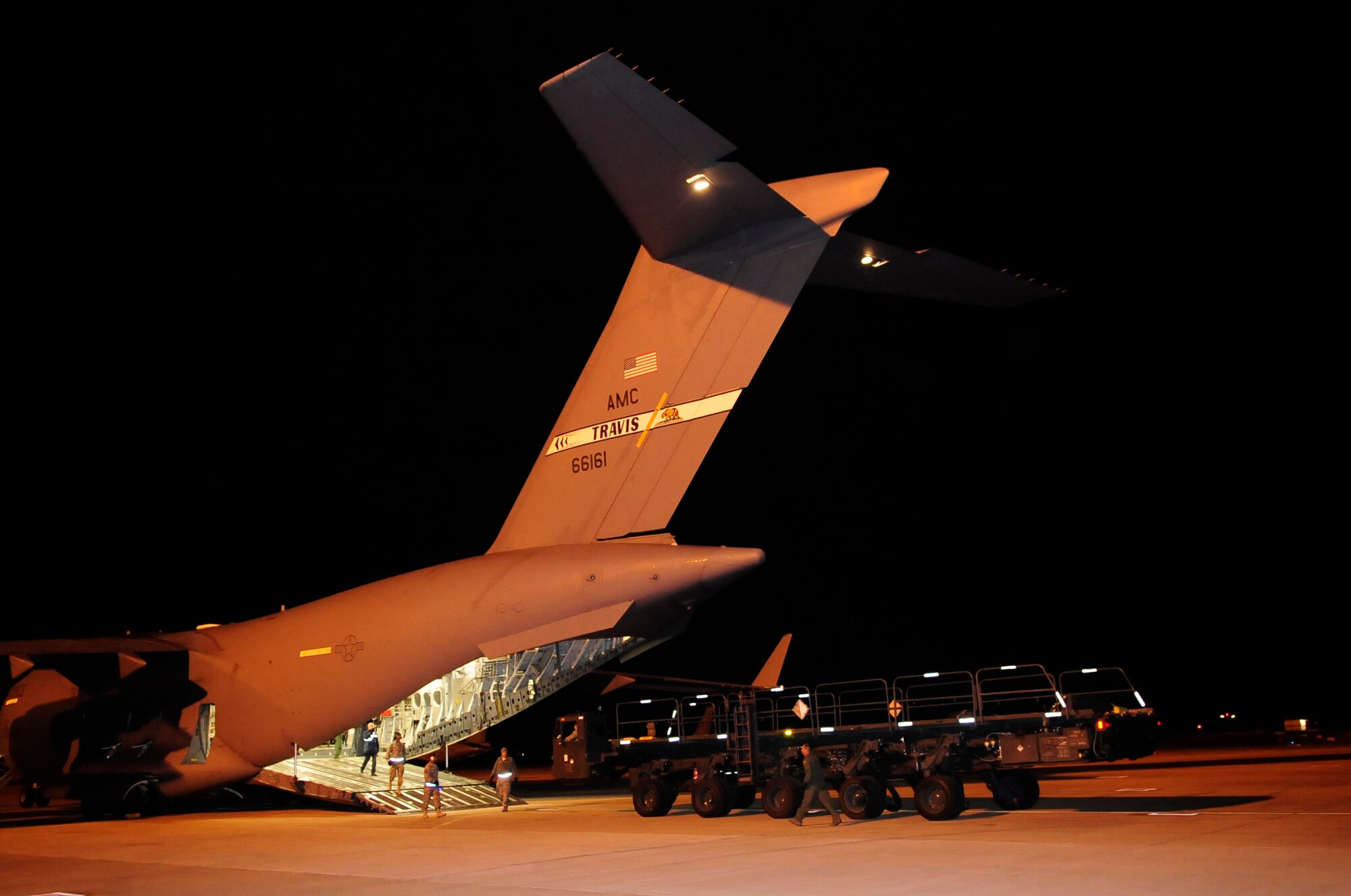313th AIR EXPEDITIONARY WING (March 28, 2011) -- A 60K loader is unloaded off a C-17 Globemaster III here to be used in support of Joint Task Force Odyssey Dawn. Joint Task Force Odyssey Dawn was the U.S. Africa Command task force established to provide operational and tactical command and control of U.S. military forces supporting the international response to the unrest in Libya and enforcement of United Nations Security Council Resolution (UNSCR) 1973. UNSCR 1973 authorizes all necessary measures to protect civilians in Libya under threat of attack by Gadhafi regime forces. JTF Odyssey Dawn was commanded by U.S. Navy Admiral Samuel J. Locklear III. (U.S. Air Force photo/Senior Airman Ethan Morgan)