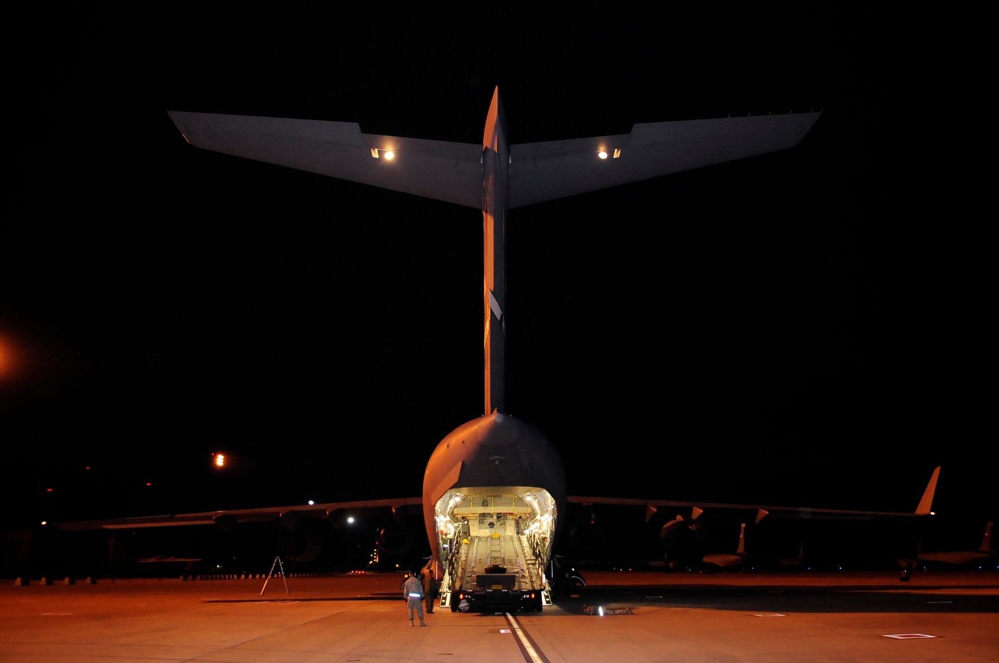 313th AIR EXPEDITIONARY WING (March 28, 2011) -- A 60K loader is unloaded off a C-17 Globemaster III to be used in support of Joint Task Force Odyssey Dawn. Joint Task Force Odyssey Dawn was the U.S. Africa Command task force established to provide operational and tactical command and control of U.S. military forces supporting the international response to the unrest in Libya and enforcement of United Nations Security Council Resolution (UNSCR) 1973. UNSCR 1973 authorizes all necessary measures to protect civilians in Libya under threat of attack by Gadhafi regime forces. JTF Odyssey Dawn was commanded by U.S. Navy Admiral Samuel J. Locklear III. (U.S. Air Force photo/Senior Airman Ethan Morgan)