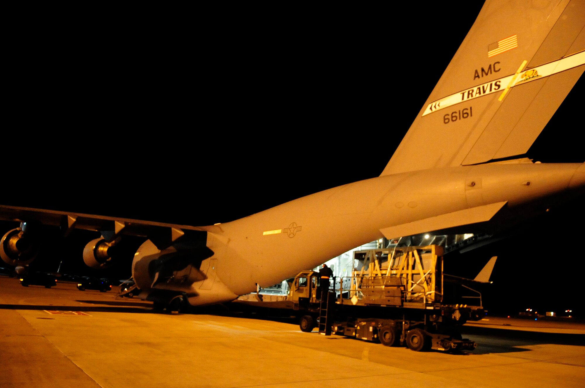 313th AIR EXPEDITIONARY WING (March 28, 2011) -- A pallet is unloaded off a C-17 Globemaster III with a 25K next generation small loader during support of Joint Task Force Odyssey Dawn. Joint Task Force Odyssey Dawn was the U.S. Africa Command task force established to provide operational and tactical command and control of U.S. military forces supporting the international response to the unrest in Libya and enforcement of United Nations Security Council Resolution (UNSCR) 1973. UNSCR 1973 authorizes all necessary measures to protect civilians in Libya under threat of attack by Gadhafi regime forces. JTF Odyssey Dawn was commanded by U.S. Navy Admiral Samuel J. Locklear III. (U.S. Air Force photo/Senior Airman Ethan Morgan)