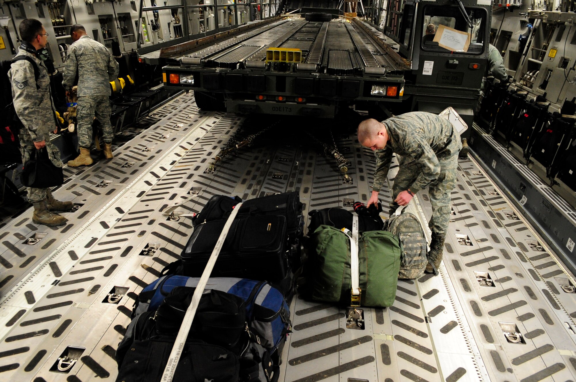 313th AIR EXPEDITIONARY WING (March 28, 2011) -- Airmen from the 721st Aerial Port Squadron, Ramstein Air Base, Germany, prepare to unload a C-17 Globemaster III during support of Joint Task Force Odyssey Dawn. Joint Task Force Odyssey Dawn was the U.S. Africa Command task force established to provide operational and tactical command and control of U.S. military forces supporting the international response to the unrest in Libya and enforcement of United Nations Security Council Resolution (UNSCR) 1973. UNSCR 1973 authorizes all necessary measures to protect civilians in Libya under threat of attack by Gadhafi regime forces. JTF Odyssey Dawn was commanded by U.S. Navy Admiral Samuel J. Locklear III. (U.S. Air Force photo/Senior Airman Ethan Morgan)