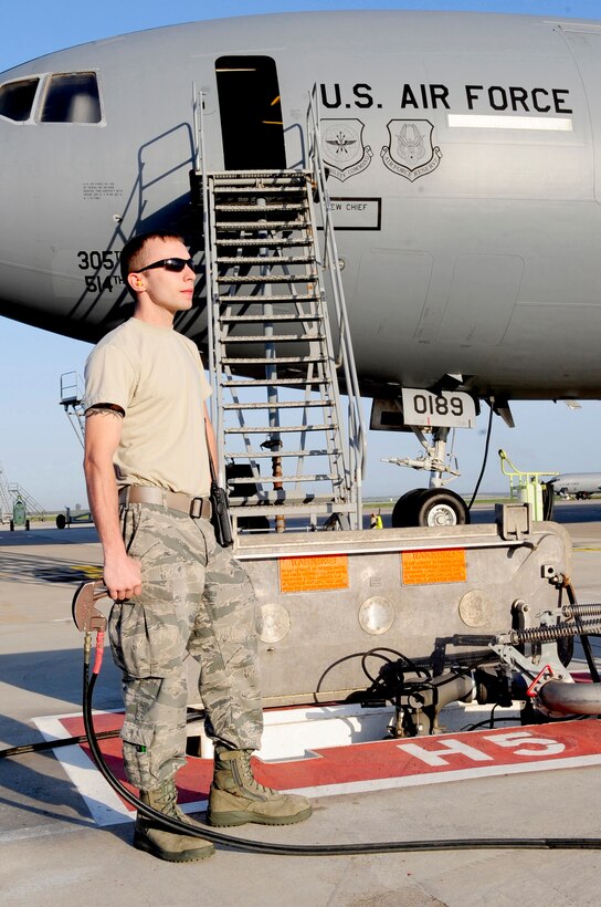 313th AIR EXPEDITIONARY WING (March 28, 2011) -- An 86th Logistics Readiness Squadron professional fuels handler, deployed from Ramstein Air Base, Germany, pumps fuel into a KC-10 Extender in support of Joint Task Force Odyssey Dawn. Joint Task Force Odyssey Dawn was the U.S. Africa Command task force established to provide operational and tactical command and control of U.S. military forces supporting the international response to the unrest in Libya and enforcement of United Nations Security Council Resolution (UNSCR) 1973. UNSCR 1973 authorizes all necessary measures to protect civilians in Libya under threat of attack by Gadhafi regime forces. JTF Odyssey Dawn was commanded by U.S. Navy Admiral Samuel J. Locklear III. (U.S. Air Force photo/Senior Airman Ethan Morgan)
