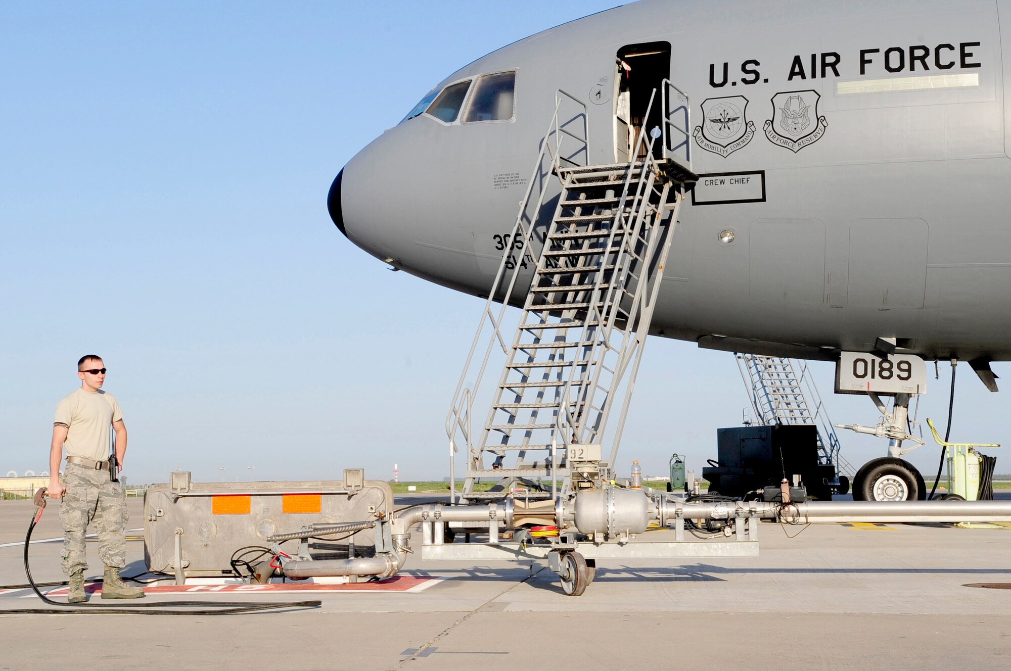 313th AIR EXPEDITIONARY WING (March 28, 2011) -- An 86th Logistics Readiness Squadron professional fuels handler deployed from Ramstein Air Base, Germany, pumps fuel into a KC-10 Extender in support of Joint Task Force Odyssey Dawn. Joint Task Force Odyssey Dawn was the U.S. Africa Command task force established to provide operational and tactical command and control of U.S. military forces supporting the international response to the unrest in Libya and enforcement of United Nations Security Council Resolution (UNSCR) 1973. UNSCR 1973 authorizes all necessary measures to protect civilians in Libya under threat of attack by Gadhafi regime forces. JTF Odyssey Dawn was commanded by U.S. Navy Admiral Samuel J. Locklear III. (U.S. Air Force photo/Senior Airman Ethan Morgan)