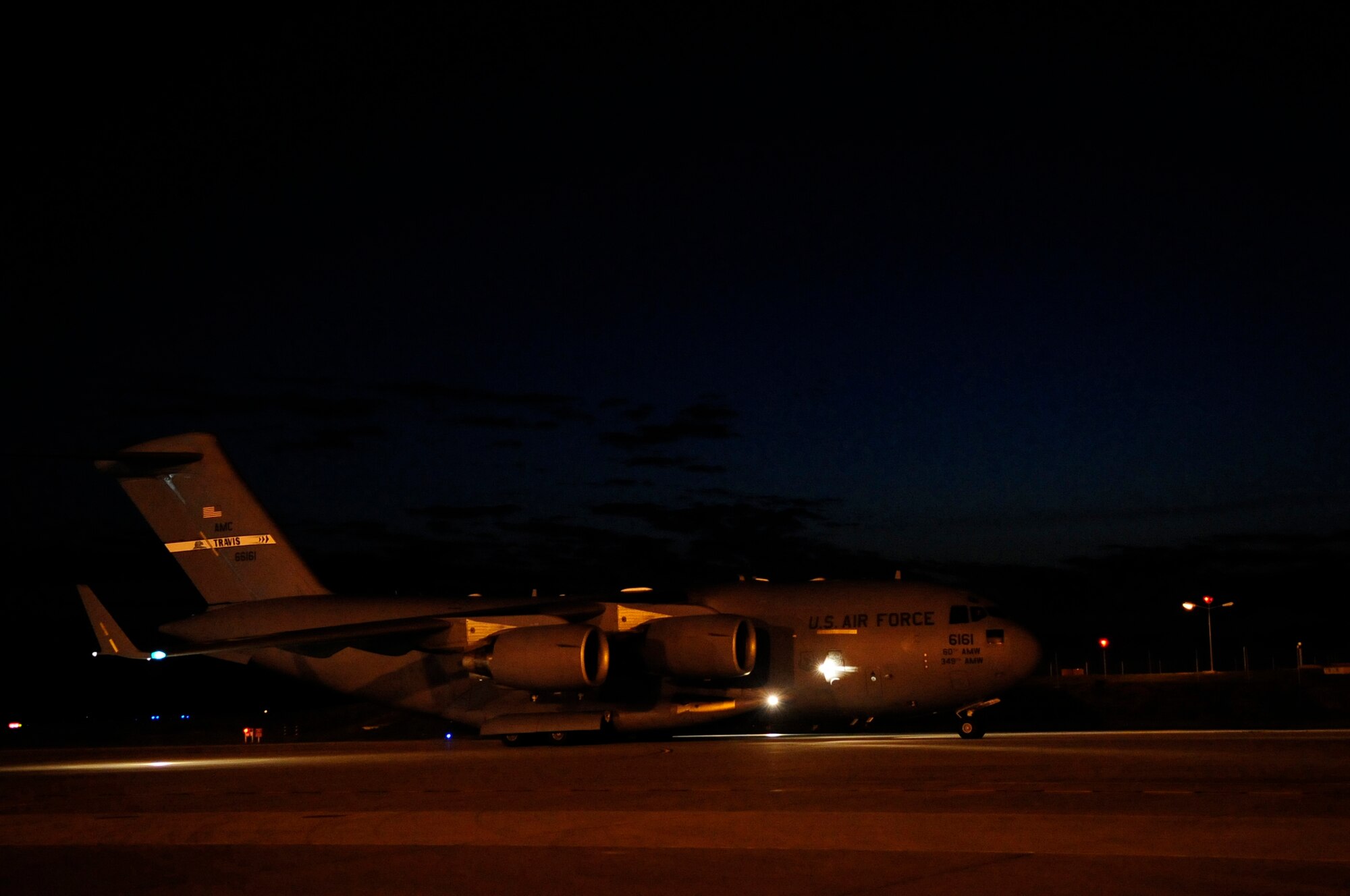 313th AIR EXPEDITIONARY WING (March 28, 2011) -- A C-17 Globemaster III from Travis Air Force Base, Calif., taxis on the runway during support of Joint Task Force Odyssey Dawn. Joint Task Force Odyssey Dawn was the U.S. Africa Command task force established to provide operational and tactical command and control of U.S. military forces supporting the international response to the unrest in Libya and enforcement of United Nations Security Council Resolution (UNSCR) 1973. UNSCR 1973 authorizes all necessary measures to protect civilians in Libya under threat of attack by Gadhafi regime forces. JTF Odyssey Dawn was commanded by U.S. Navy Admiral Samuel J. Locklear III. (U.S. Air Force photo/Senior Airman Ethan Morgan)