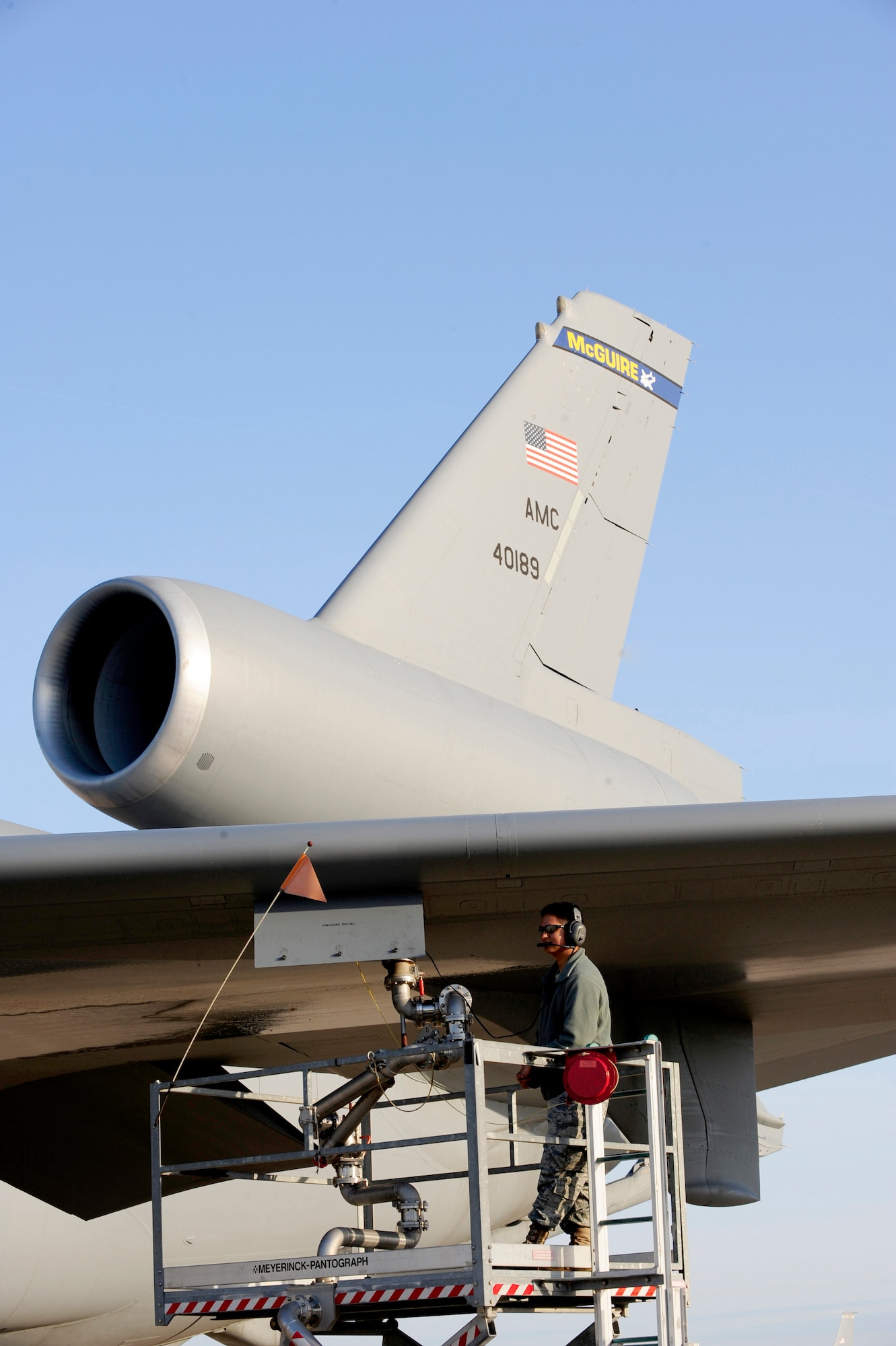 313th AIR EXPEDITIONARY WING (March 28, 2011) -- A 660th Aircraft Maintenance Squadron crew chief deployed from MacDill Air Force Base, Fla., monitors a pantograph as it pumps fuel into a KC-10 Extender in support of Joint Task Force Odyssey Dawn. Joint Task Force Odyssey Dawn was the U.S. Africa Command task force established to provide operational and tactical command and control of U.S. military forces supporting the international response to the unrest in Libya and enforcement of United Nations Security Council Resolution (UNSCR) 1973. UNSCR 1973 authorizes all necessary measures to protect civilians in Libya under threat of attack by Gadhafi regime forces. JTF Odyssey Dawn was commanded by U.S. Navy Admiral Samuel J. Locklear III. (U.S. Air Force photo/Senior Airman Ethan Morgan)
