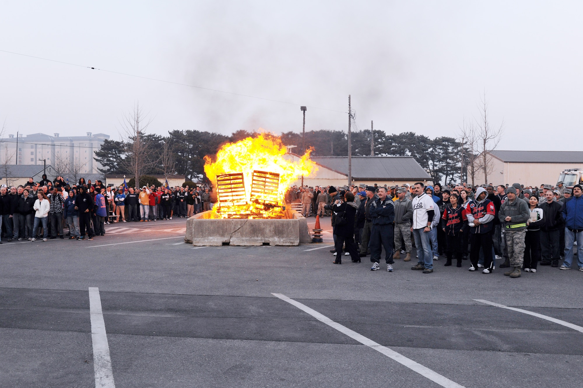 KUNSAN AIR BASE, Republic of Korea --  Wolf Pack Airmen gather around a bonfire as they listen to the Wolf, Col. John Dolan, 8th Fighter Wing commander, speak during a pep rally March 31 for the start of the base Pacific Air Force Operational Readiness Inspection. (U.S. Air Force photo/Tech. Sgt. Jonathan Pomeroy)

