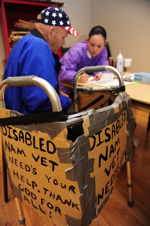 LAS VEGAS --  David Pettit, receives information about dental care from Michelle Alcazar, of the Veteran Affairs Dental Services, about free care during a Veterans Stand Down, March 24.  The Veterans Stand Down provides homeless veterans emergency and supportive housing, food, health services, job training, legal aid and other assistance to help them live a better life.   (U.S. Air Force photo by Staff Sgt. William P.Coleman)
  

