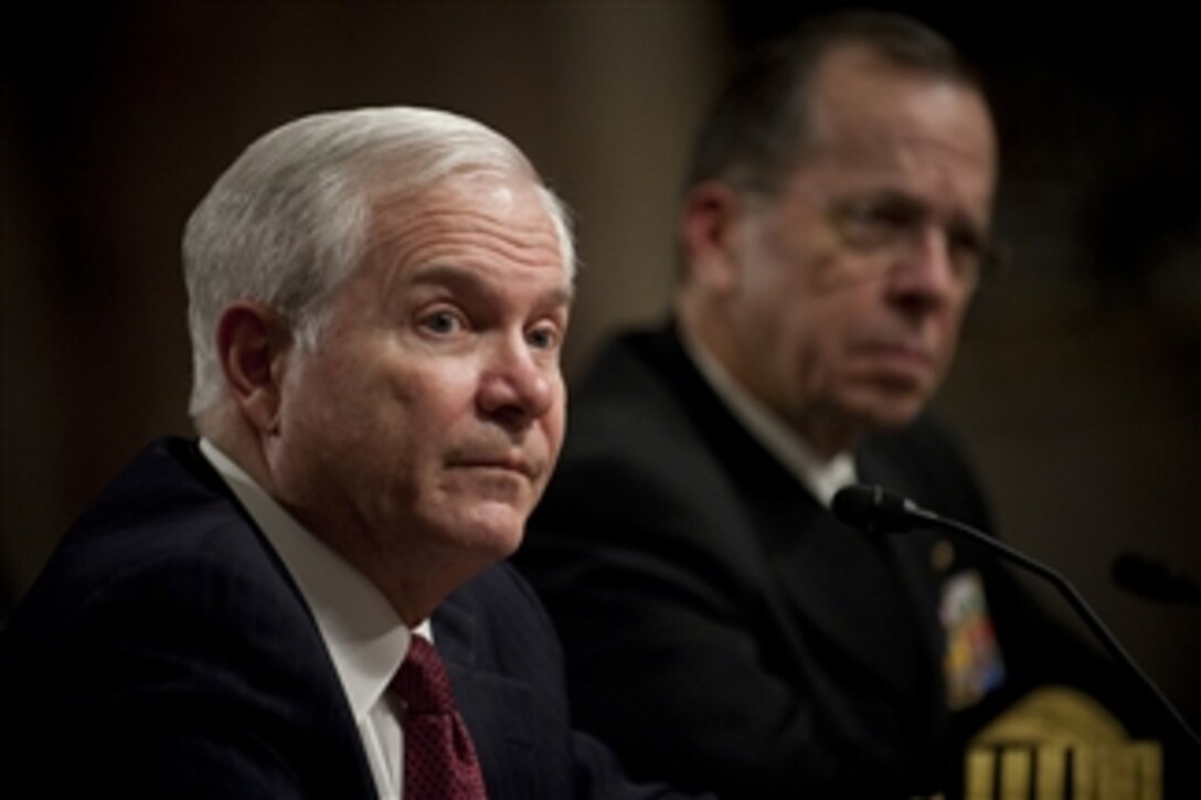 Secretary of Defense Robert M. Gates and Chairman of the Joint Chiefs of Staff Adm. Mike Mullen testify at a hearing of the Senate Armed Services Committee on operations in Libya at the Dirksen Senate Office Building in Washington, D.C., on March 31, 2011.  