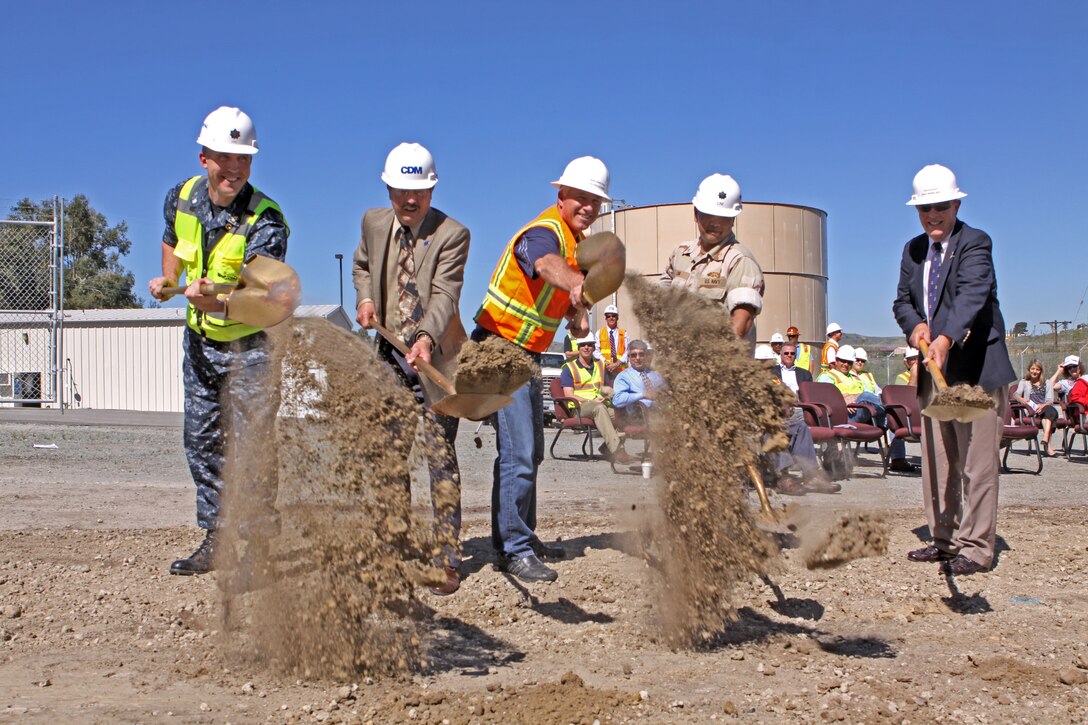 (Left to right) Cmdr. Scott King, resident officer-in-charge of construction, Marine Corps Base Camp Pendleton; John Price, senior vice-president, CDM Constructors Inc.; Marc Engstrom, utilities division director, Facilities Maintenance Division, MCB Camp Pendleton; Cmdr. Gus Lim, public works officer, MCB Camp Pendleton; Ron Couchot, utilities team lead, Public Works Office, MCB Camp Pendleton; break ground on Camp Pendleton’s Advanced Water Treatment System, April 1. The $46.3 million state-of-the-art AWTS will help Camp Pendleton adhere to the new state initiative to improve water quality standards. Filtration systems and domestic water softeners, often found in many base homes, will no longer be needed due to the new system, saving base residents money. While the current product is both safe and compliant with state requirements, Camp Pendleton will soon have the highest quality water in San Diego County as a result of this project. The AWTS is scheduled to be completed December 2012.