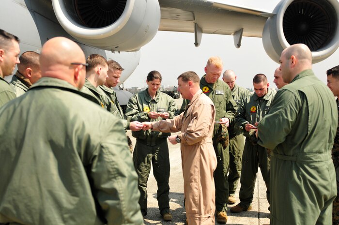 YOKOTA AIR BASE, Japan -- The Secretary of Defense recently approved the order for Chemical Biological Incident Response Force, II Marine Expeditionary Force to deploy an Initial Response Force (IRF) to Japan in support of Operation Tomodachi. Approximately 15 members of the IRF deployed from Indian Head, Md. and have arrived at approximately 11 a.m. local time April 2, here at Yokota Air Base. The IRF can forward-deploy and respond to chemical, biological, radiological, nuclear incidents in order to assist in the conduct for consequence management operations. An IRF accomplishes the misson by providing capabilities for agent detection and indentification; casualty search, rescue, and personnel decontamination; and emergency medical care and stabilization of contaminated personnel. The intended mission of this IRF is to assist, and train as necessary, the Japan Self Defense Forces in the techniques and procedures they are likely to need as they respond to this crisis. (Photo by Army Agt. Cashmere C. Jefferson, Joint Support Force Public Affairs).