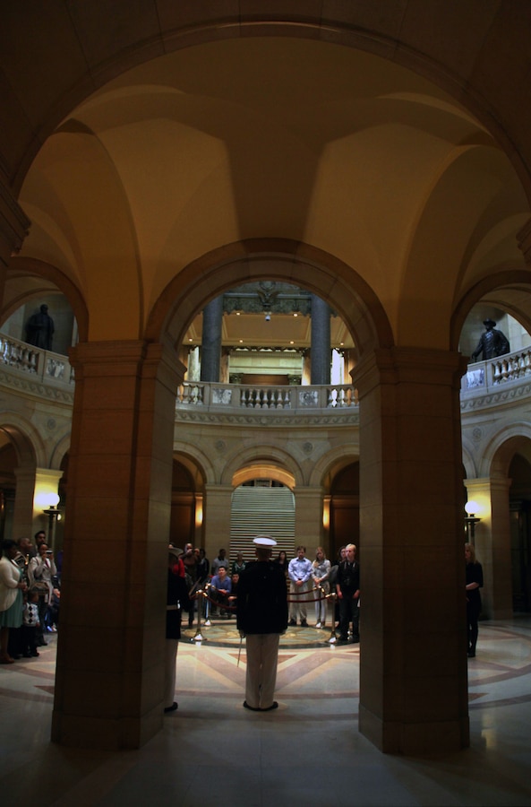 Capt. Jacob C. Aldean, Recruiting Station Twin Cities officer selection officer, calls the audience to attention to start the commissioning ceremony of two Marine Corps officers in the Minnesota State Capitol April 2. For more photos of the event, visit www.facebook.com/rstwincities.