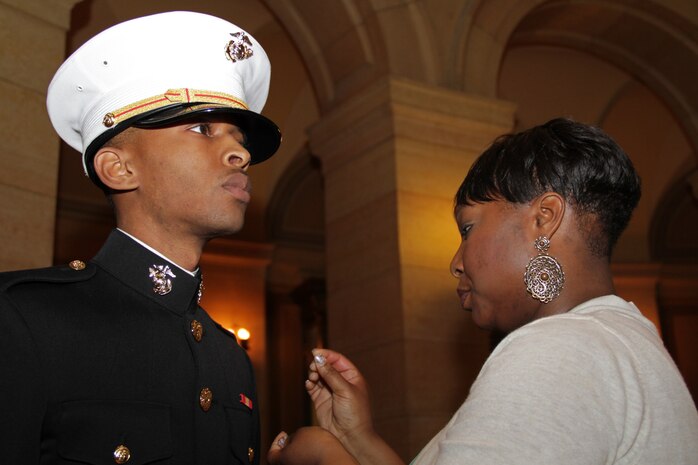 2nd Lt. Marques A. Williams' wife pins on his rank in the Minnesota State Capitol during his commissioning ceremony April 2. Williams is a 24-year-old St. Paul, Minn., native. For more photos of the event, visit www.facebook.com/rstwincities.