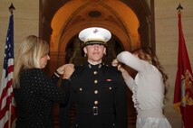 Family members pin on 2nd Lt. Tyler A. Kistner's rank in the Minnesota State Capitol during his commissioning ceremony April 2. Kistner is a 23-year-old Champlin, Minn., native. For more photos of the event, visit www.facebook.com/rstwincities.
