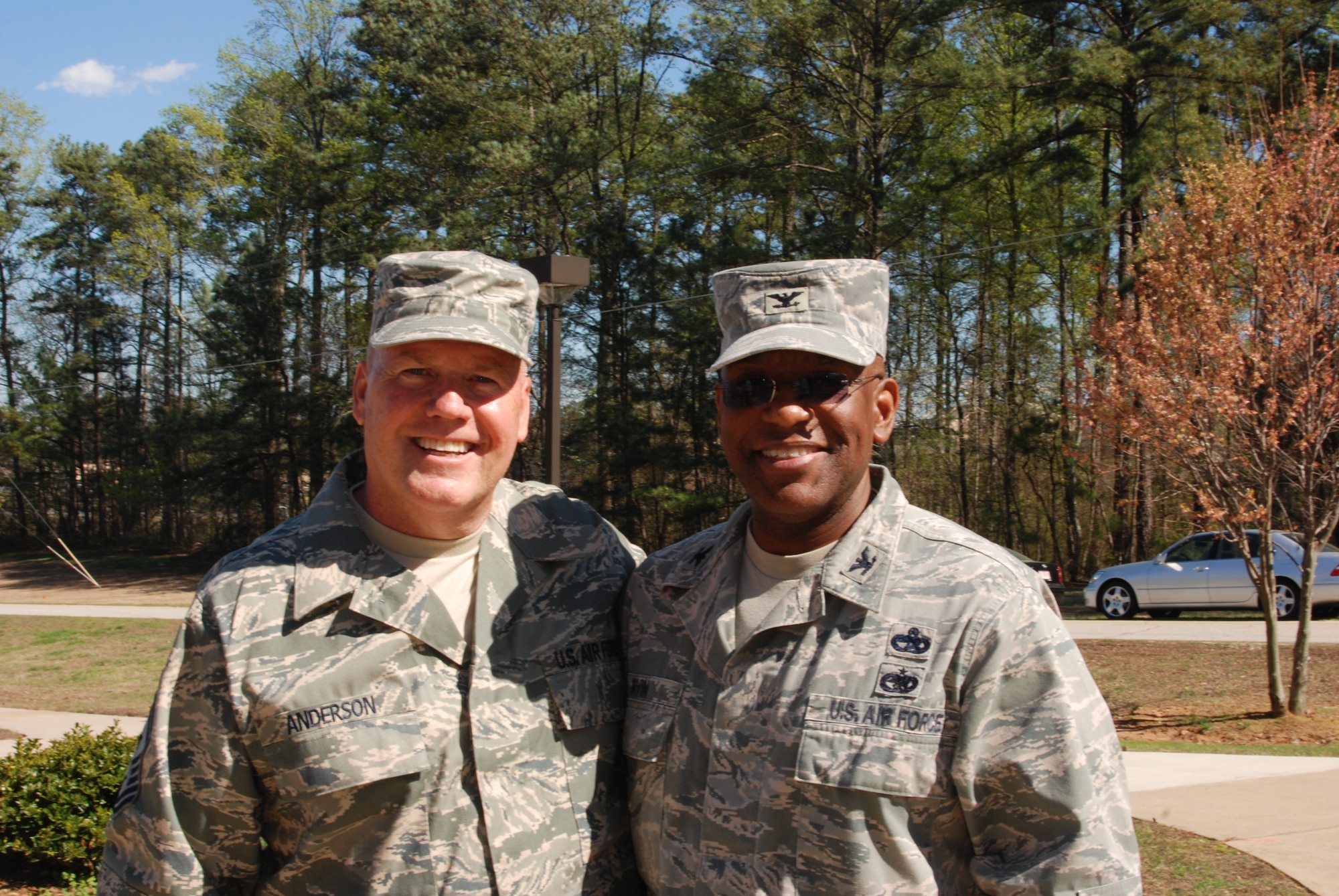 Colonel Marshall Irving, 94th Mission Support Group Commander, congratulates Chief Master Sgt. John Anderson, 94th Airlift Wing Command Chief, after 33 years of service to the Air Force during the April unit training assembly.  (U.S. Air Force photo/Master Sgt. Stan Coleman)  