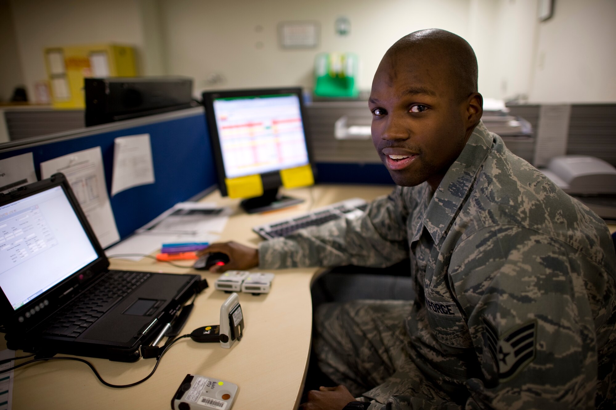 YOKOTA AIR BASE, Japan -- Staff Sgt. Shane Polk, 374th Aerospace Medicine Squadron bioenvironmental engineering flight NCO in charge of readiness and training, initializes radiation monitoring devices at Yokota Air Base, Japan, April 2, 2011. Sergeant Polk uses the devices to monitor radiation levels for the base and personnel going on missions. "Operation Tomodachi will be a mission that I'll remember for the rest of my life. Although the work is challenging and the hours are long, my 'caffeine' is monitoring radiation levels and keeping the base safe at all times." Sergeant Polk is a native of Baton Rouge, La. (U.S. Air Force photo/Staff Sgt. Samuel Morse)